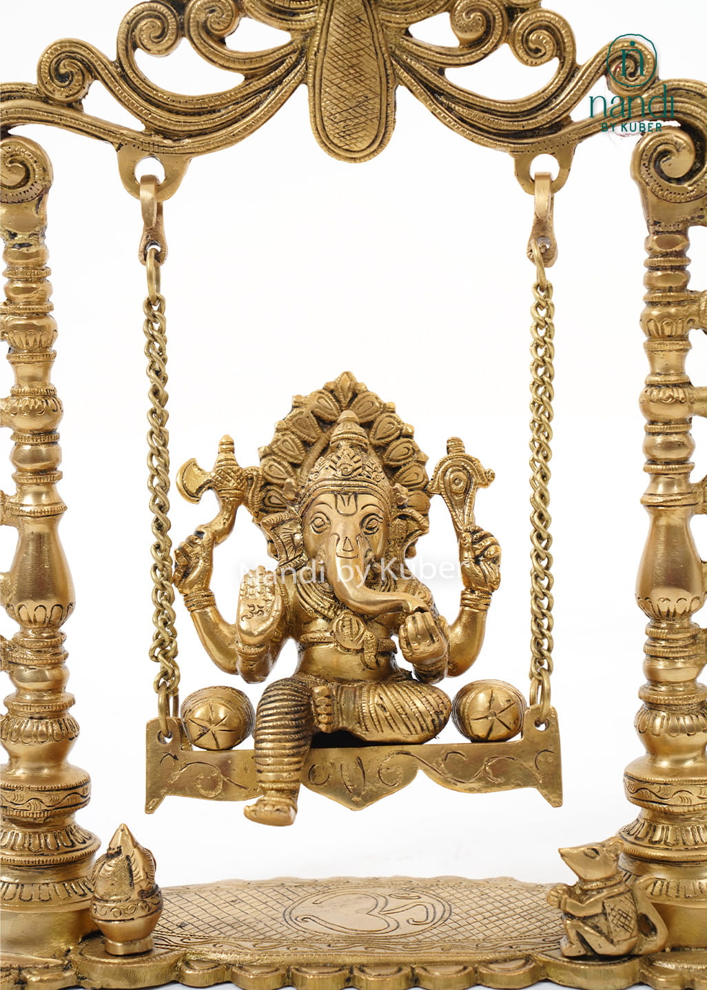 Traditional brass Ganesha Jhula featuring an intricately carved swing frame with Lord Ganesha idol for home temples and spiritual décor.
