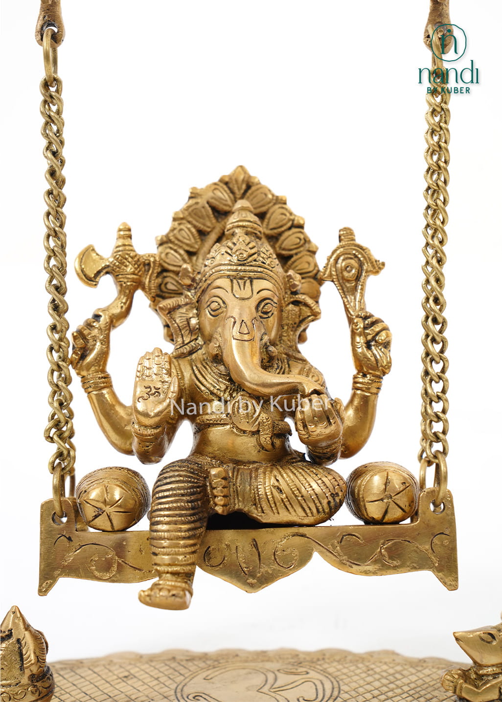 Traditional brass Ganesha Jhula featuring an intricately carved swing frame with Lord Ganesha idol for home temples and spiritual décor.
