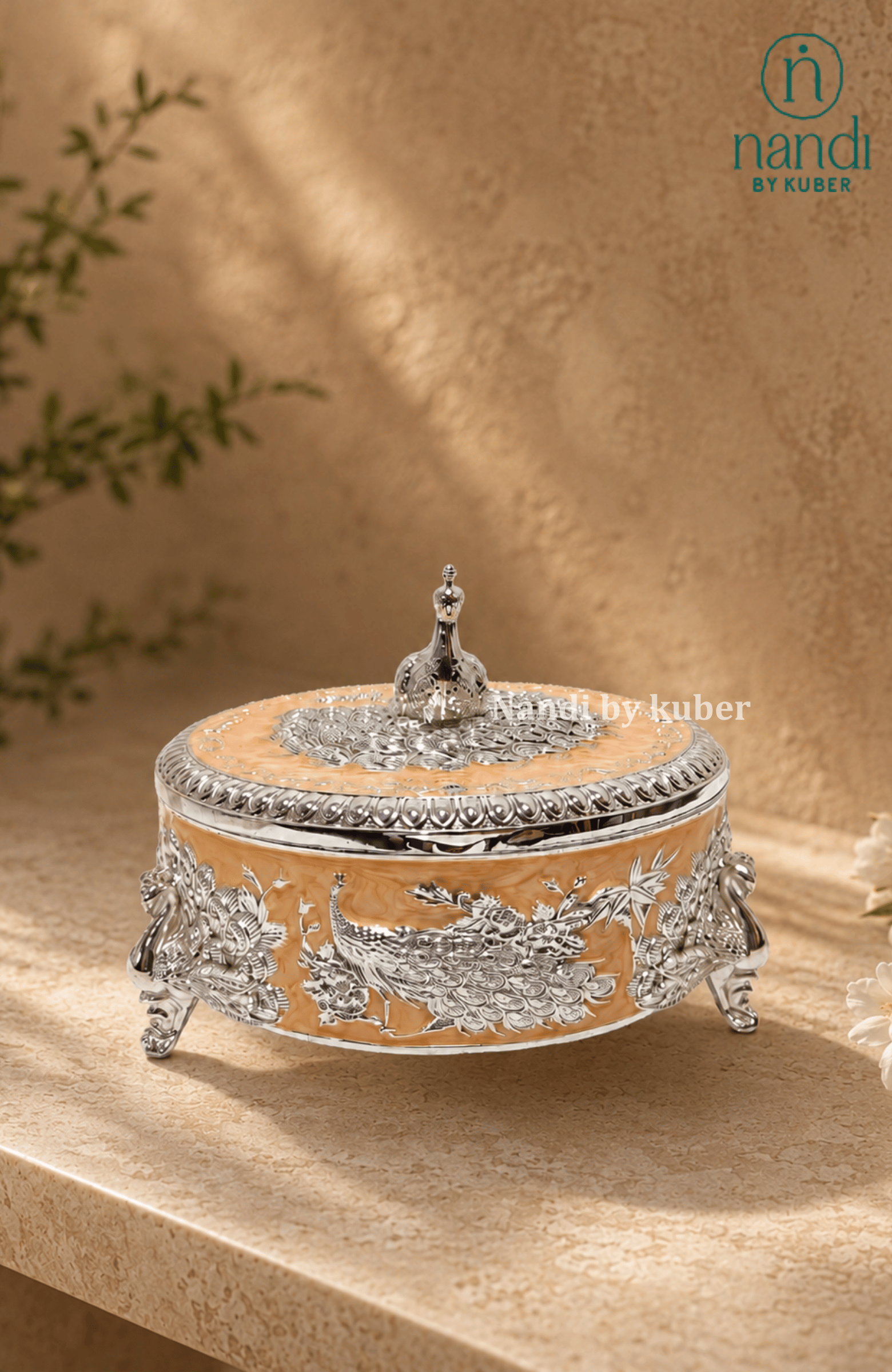 Handcrafted brass peacock round box in peach, with filigree work, ideal for jewelry storage, pooja essentials, home décor gifting, and tabletop display.
