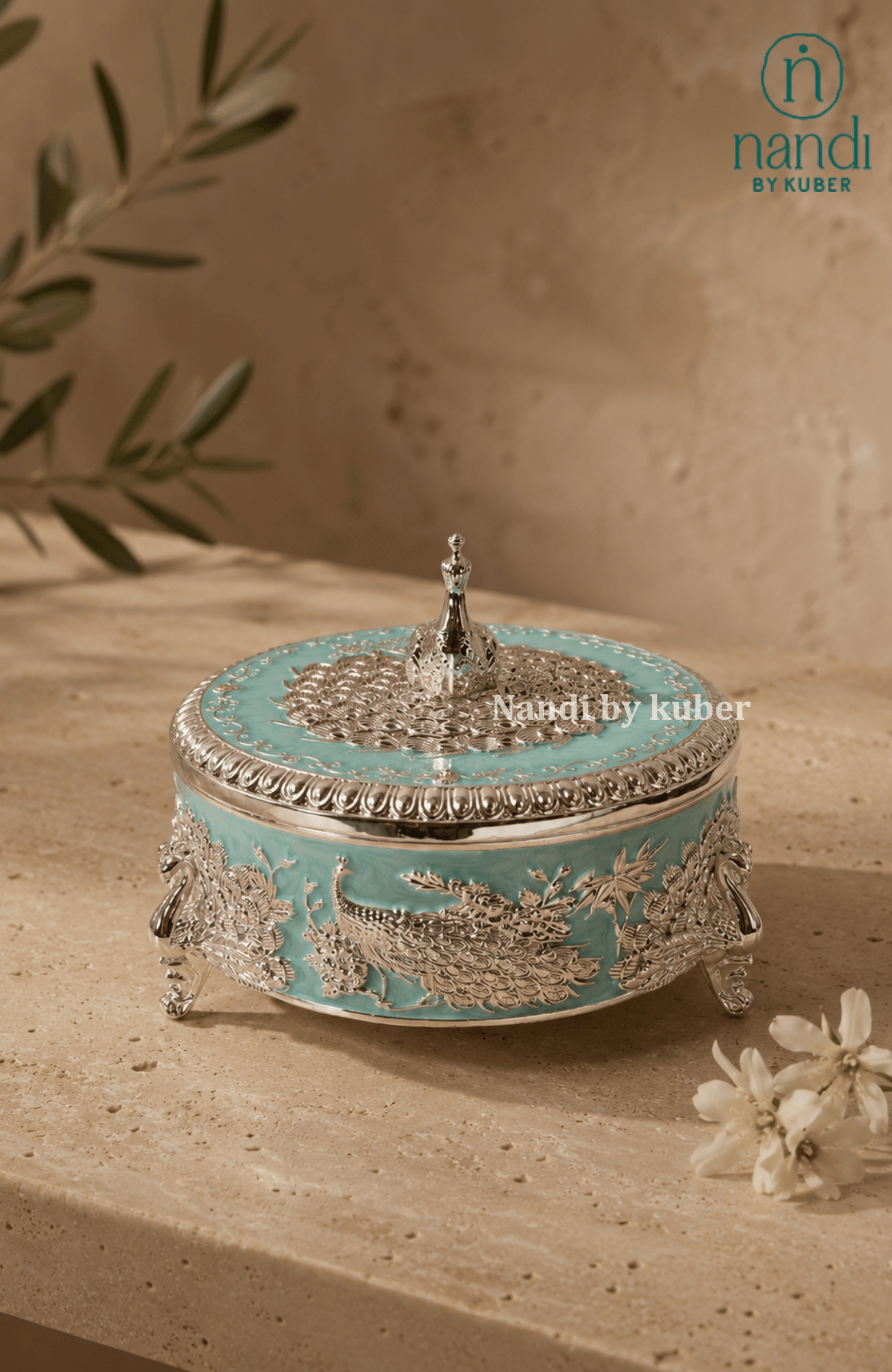 Handcrafted brass peacock round box in turquoise, with filigree work, ideal for jewelry storage, pooja essentials, home décor gifting, and tabletop display.
