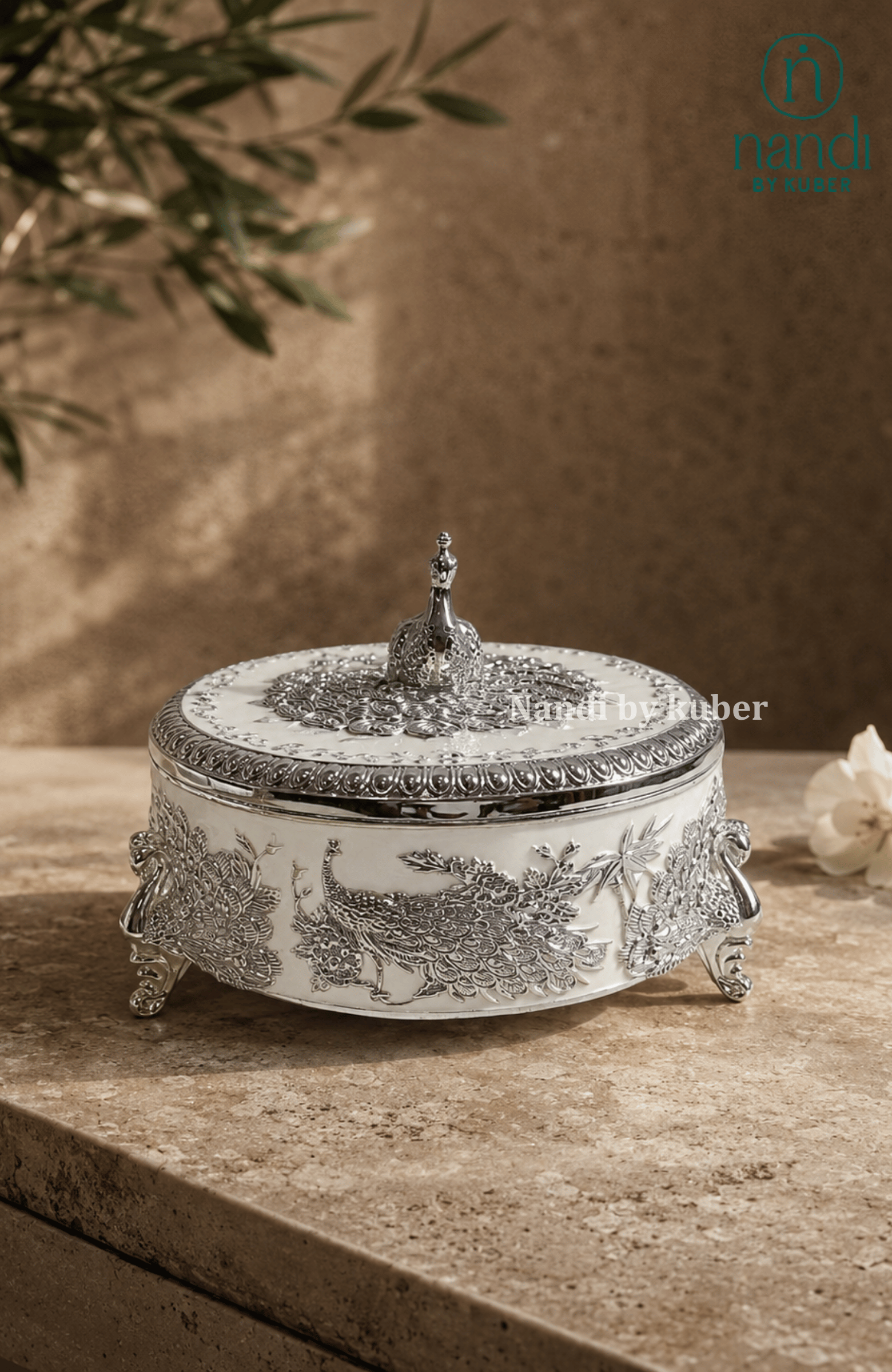 Handcrafted brass peacock round box in white, with filigree work, ideal for jewelry storage, pooja essentials, home décor gifting, and tabletop display.