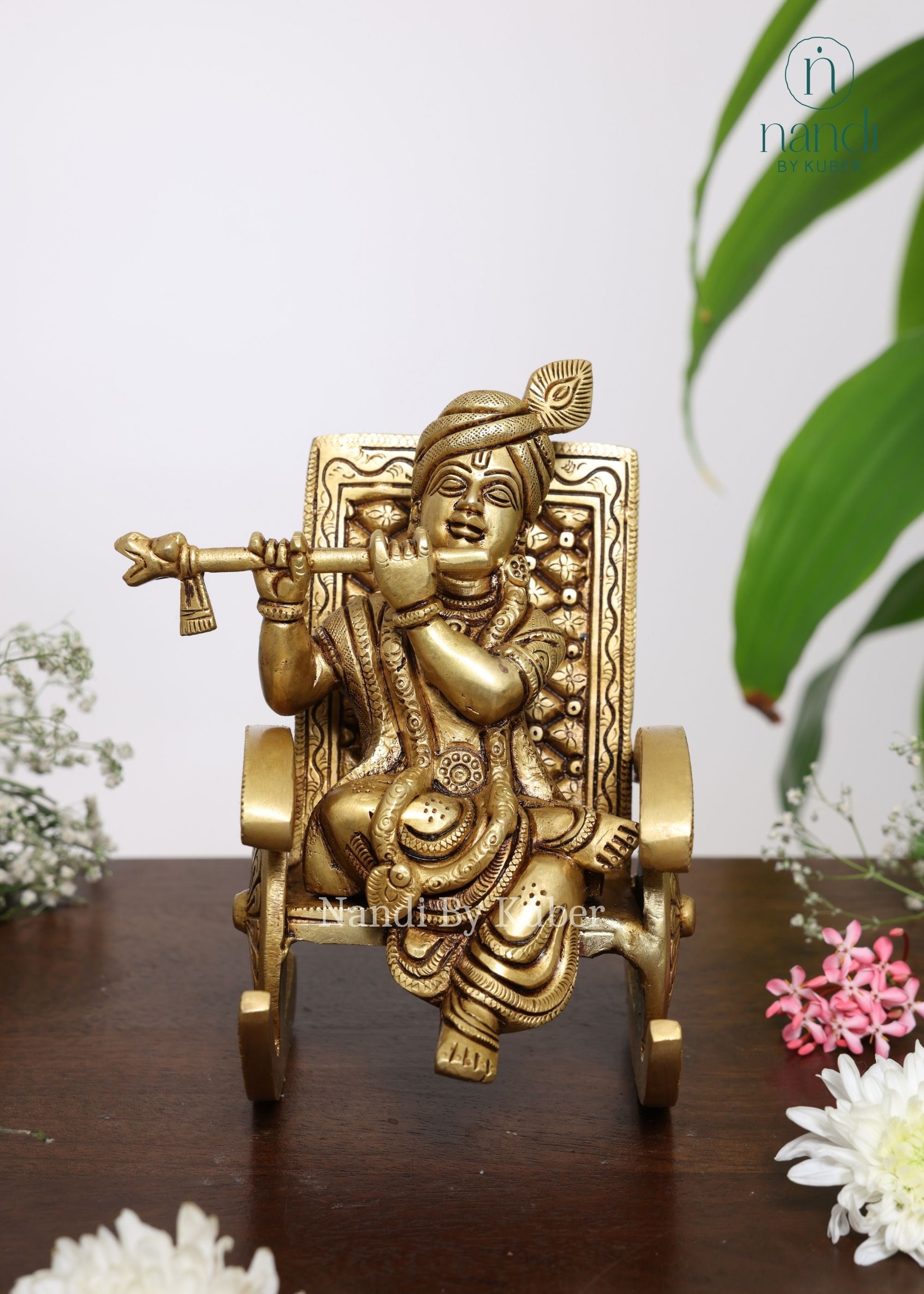 Brass Krishna Sitting On Rocking Chair - side view