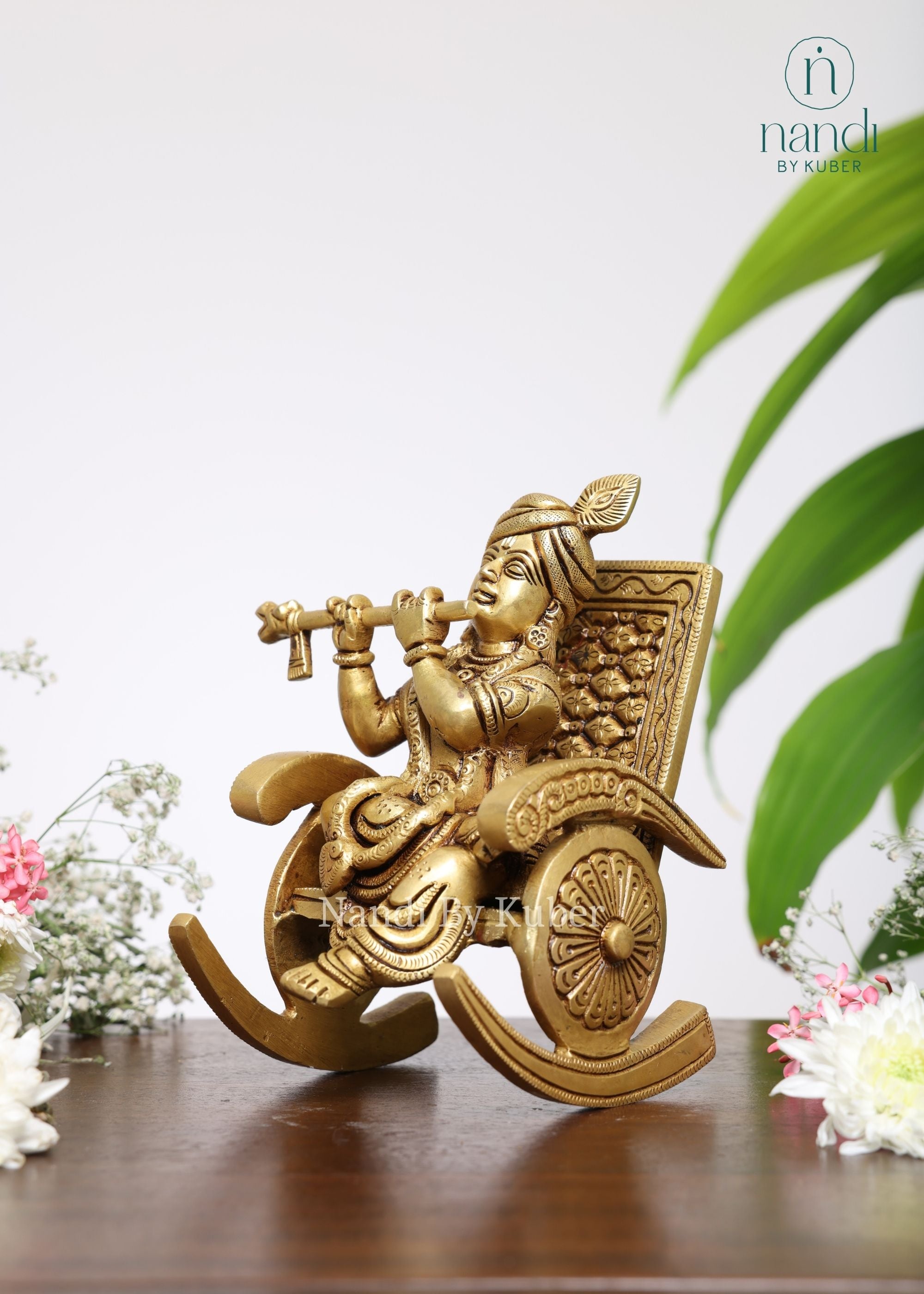 Brass Krishna Sitting On Rocking Chair - detail view