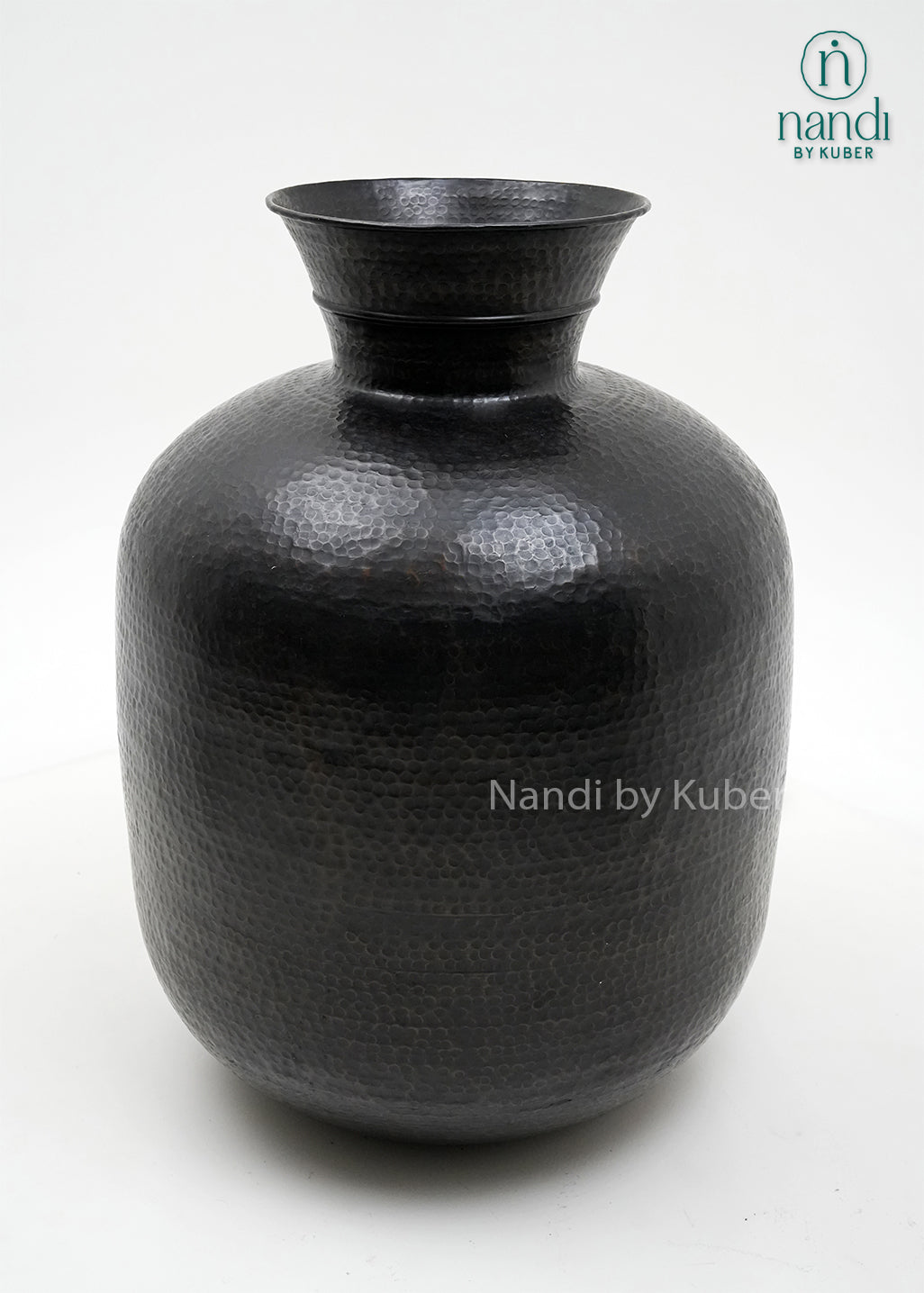 Decorative hammered aluminium planter vase with an antique black finish, perfect for displaying plants and enhancing modern or rustic interiors.