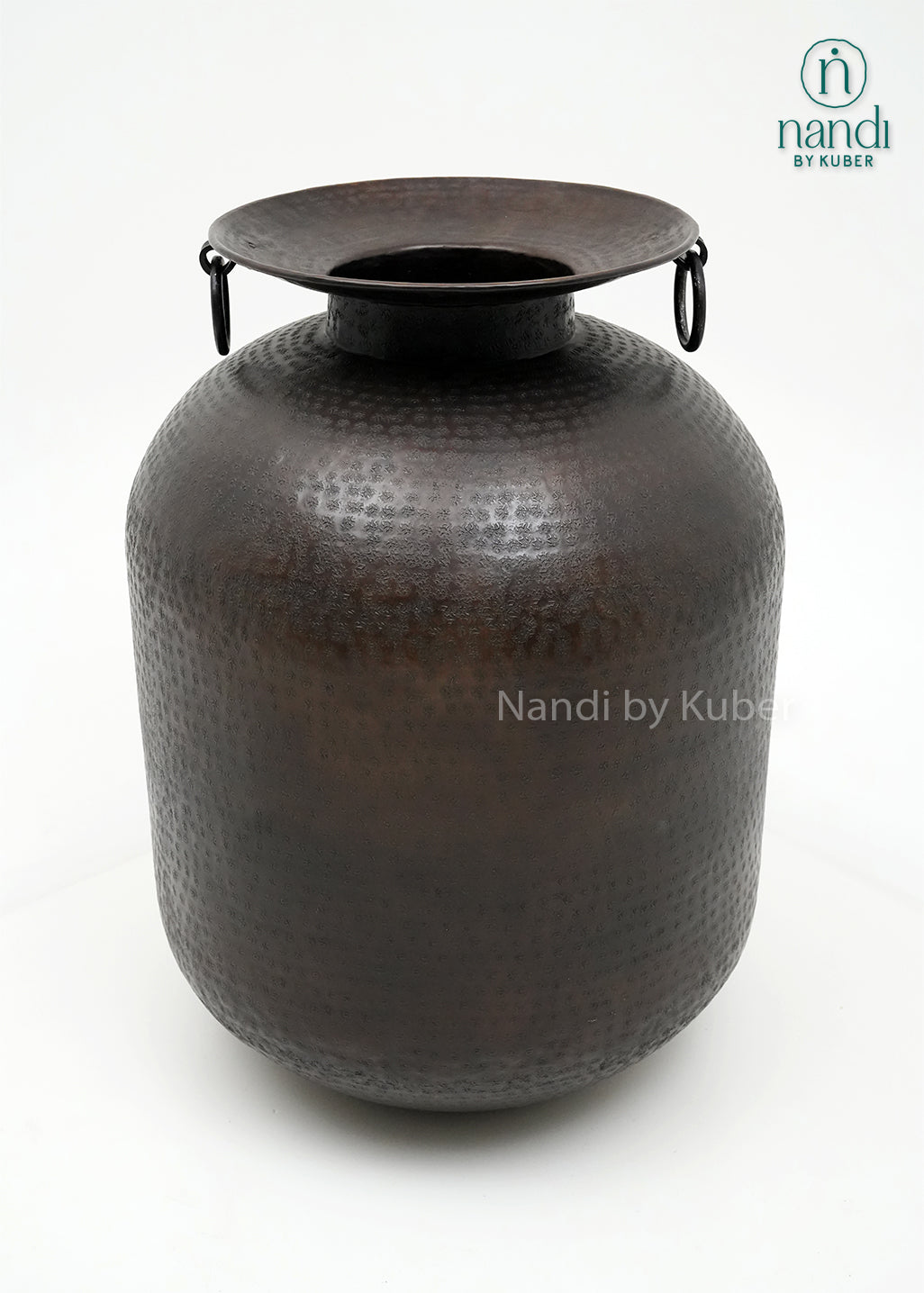 Decorative hammered aluminium planter vase with an antique black finish, perfect for displaying plants and enhancing modern or rustic interiors.