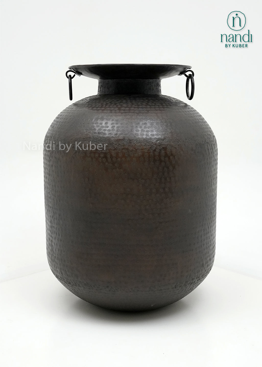 Decorative hammered aluminium planter vase with an antique black finish, perfect for displaying plants and enhancing modern or rustic interiors.