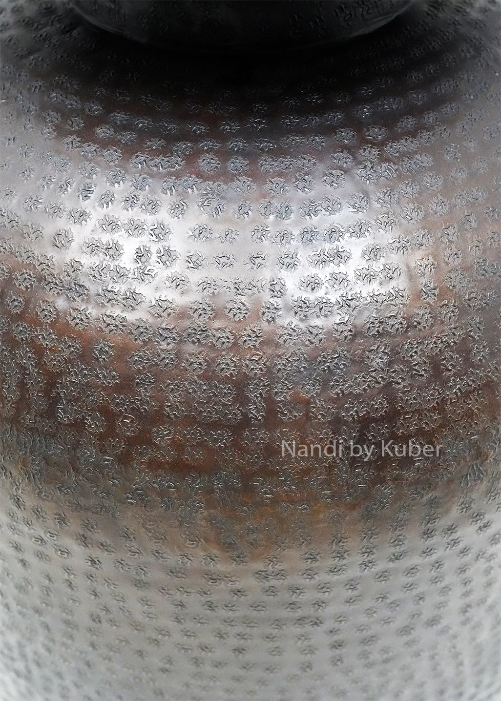 Decorative hammered aluminium planter vase with an antique black finish, perfect for displaying plants and enhancing modern or rustic interiors.