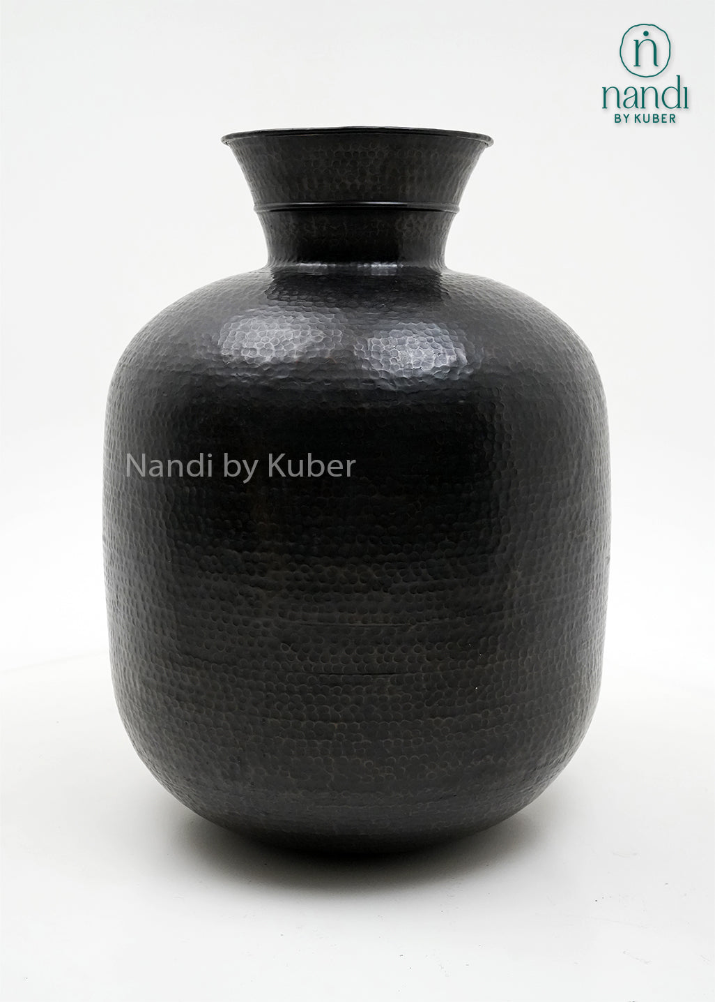 Decorative hammered aluminium planter vase with an antique black finish, perfect for displaying plants and enhancing modern or rustic interiors.