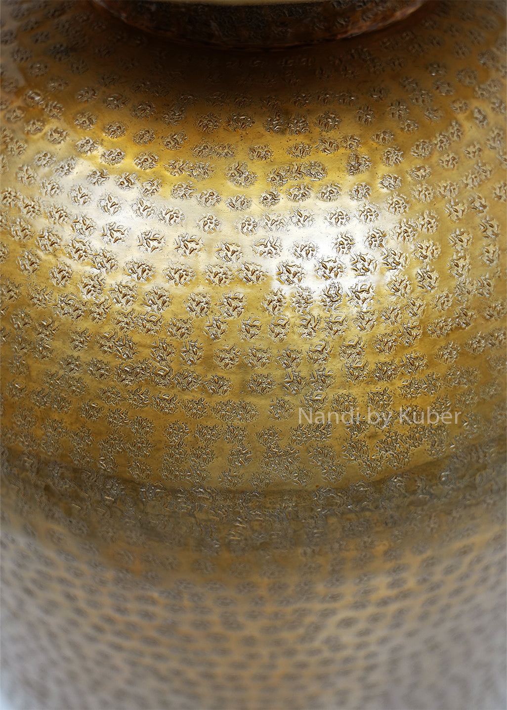 Decorative hammered aluminium planter vase with an antique gold finish, perfect for displaying plants and enhancing modern or rustic interiors.