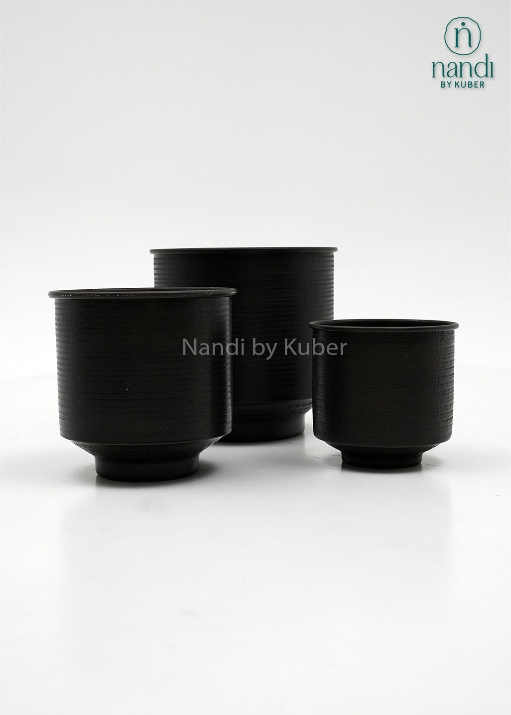 Handcrafted aluminium planter set with a textured copper , perfect for elevating plants and décor with timeless elegance.