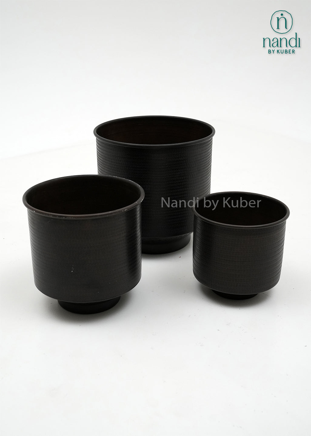 Handcrafted aluminium planter set with a textured copper , perfect for elevating plants and décor with timeless elegance.