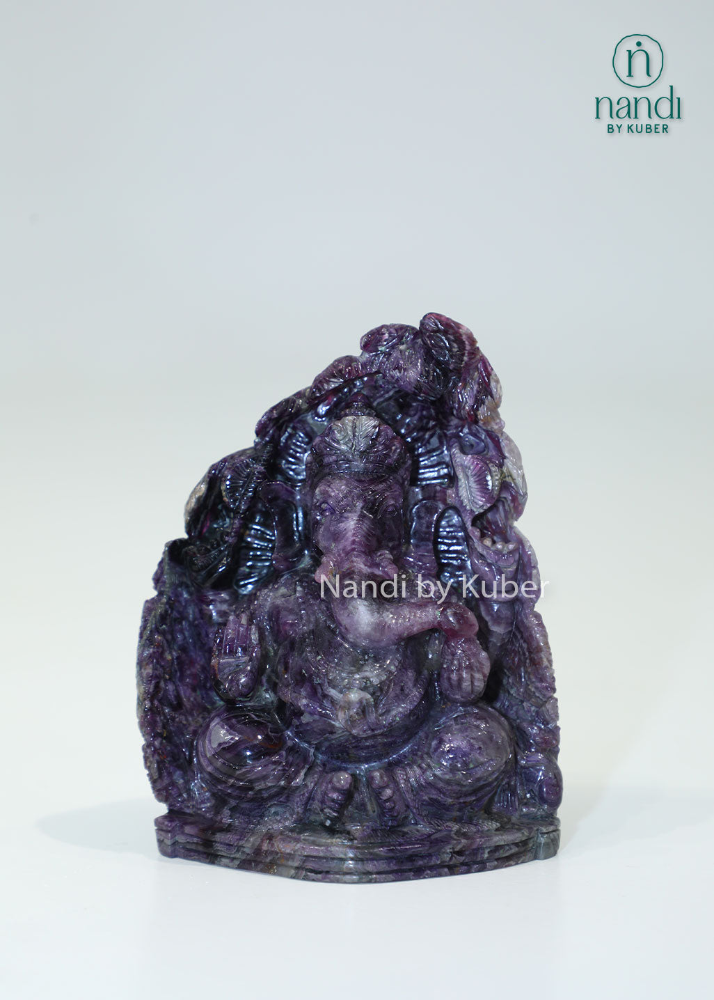 Handcrafted Amethyst Stone Ganesha sculpture featuring rich purple tones, symbolizing wisdom, prosperity, and positive energy while enhancing any sacred or decorative space.