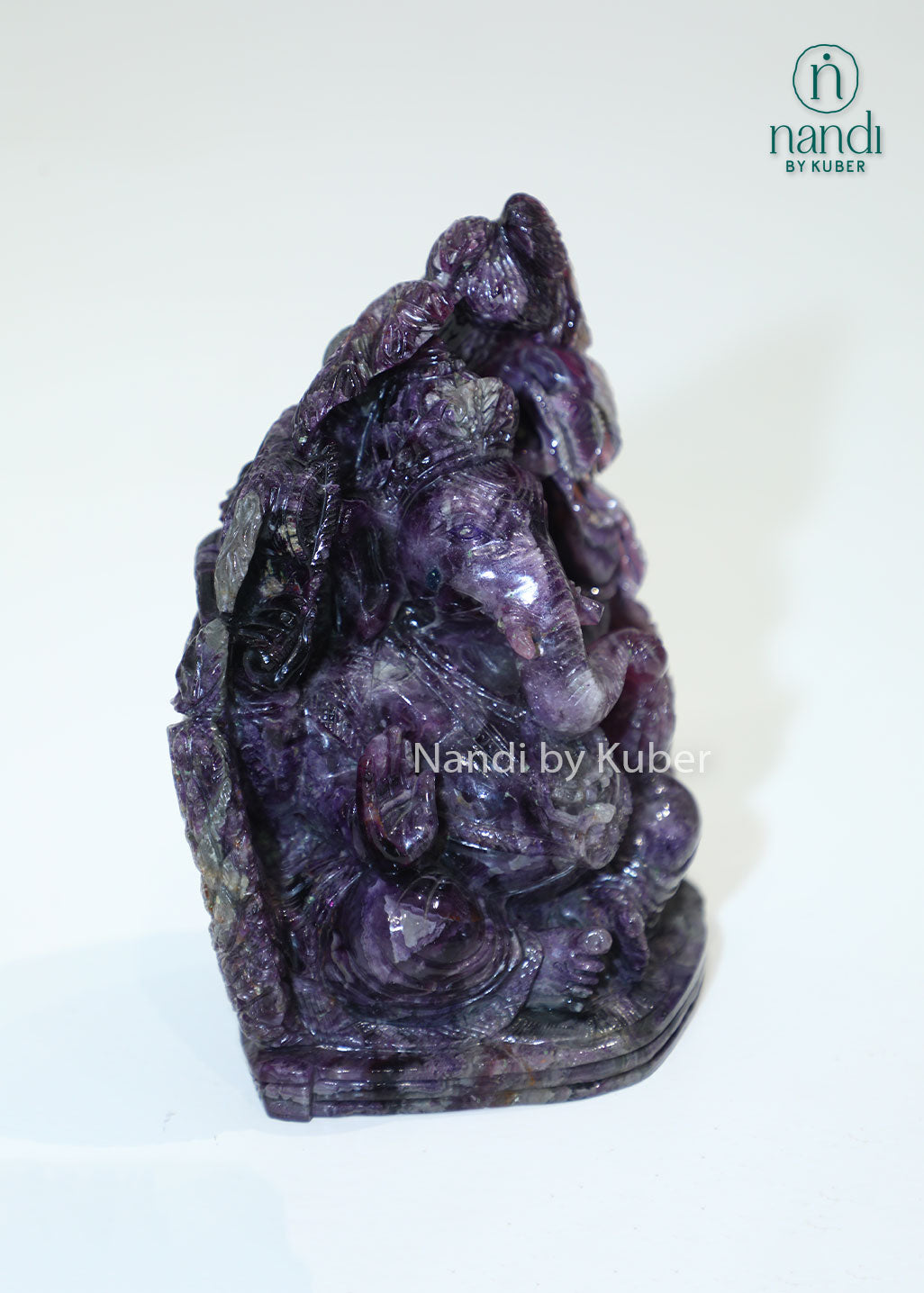 Handcrafted Amethyst Stone Ganesha sculpture featuring rich purple tones, symbolizing wisdom, prosperity, and positive energy while enhancing any sacred or decorative space.