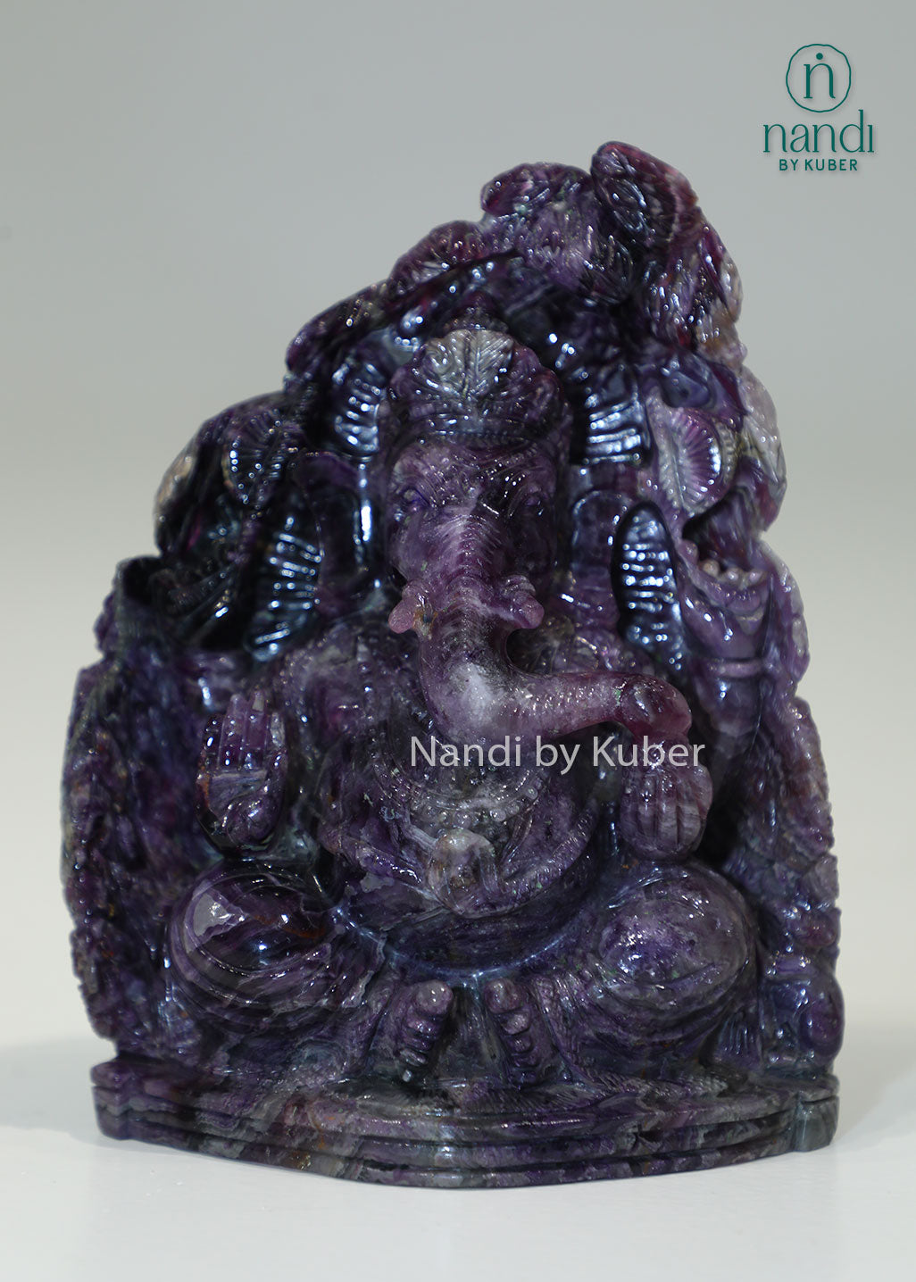 Handcrafted Amethyst Stone Ganesha sculpture featuring rich purple tones, symbolizing wisdom, prosperity, and positive energy while enhancing any sacred or decorative space.