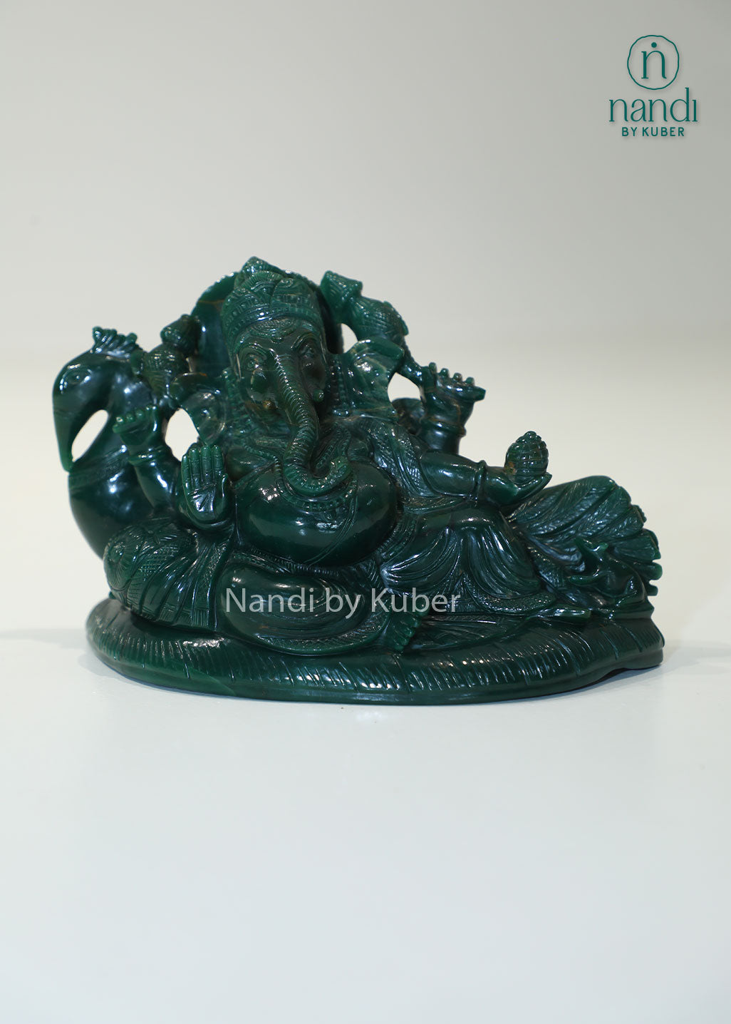 Australian jade reclining Ganesha statue, natural green gemstone Lord Ganesh idol for Vastu, prosperity, success, spiritual décor, meditation space, home temple, office decoration, and auspicious gifting.