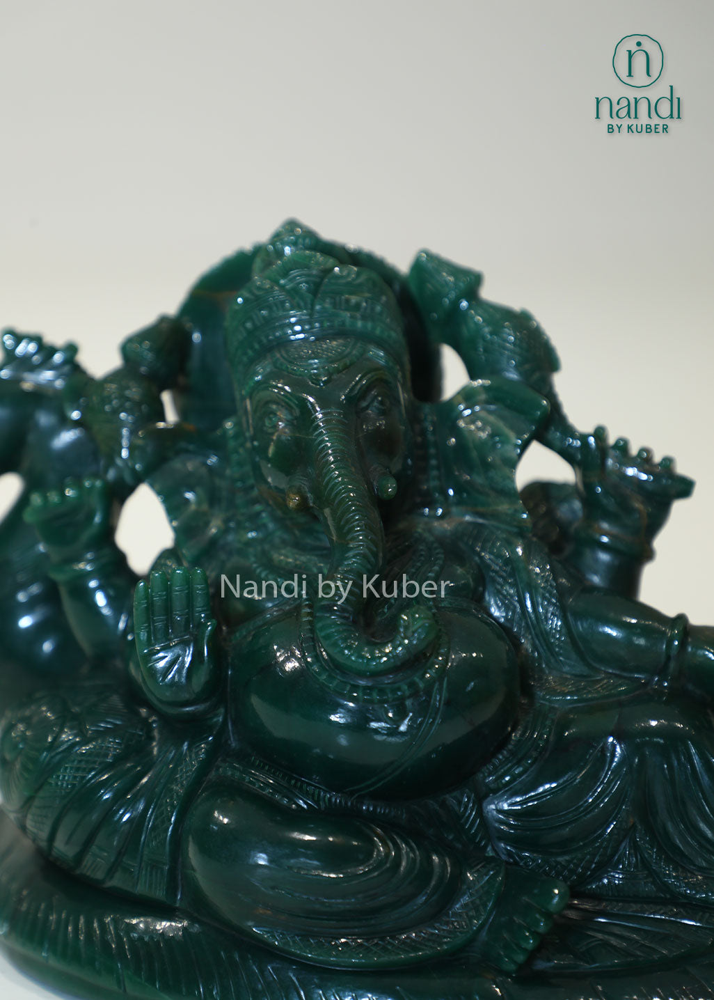 Australian jade reclining Ganesha statue, natural green gemstone Lord Ganesh idol for Vastu, prosperity, success, spiritual décor, meditation space, home temple, office decoration, and auspicious gifting.