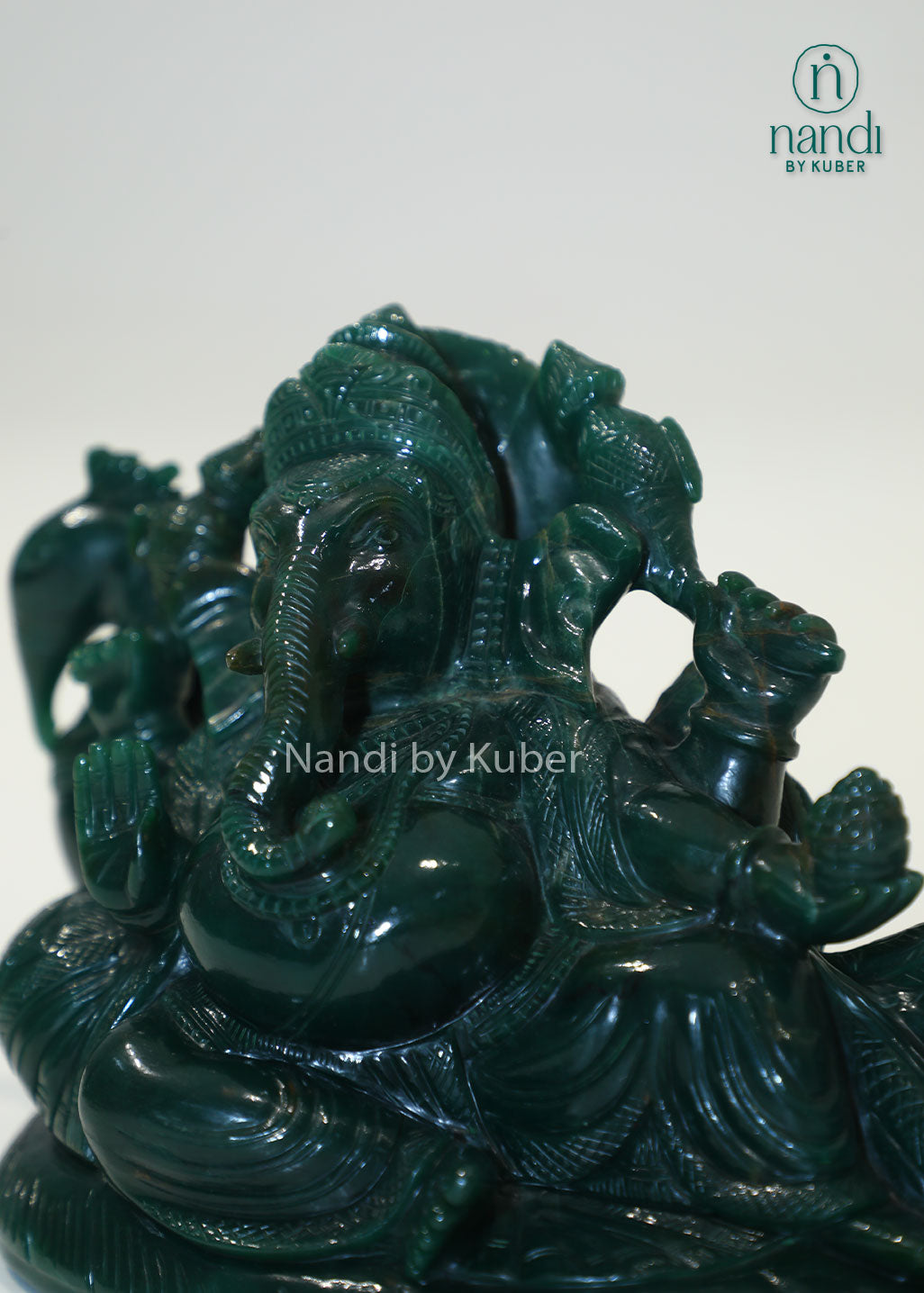 Australian jade reclining Ganesha statue, natural green gemstone Lord Ganesh idol for Vastu, prosperity, success, spiritual décor, meditation space, home temple, office decoration, and auspicious gifting.