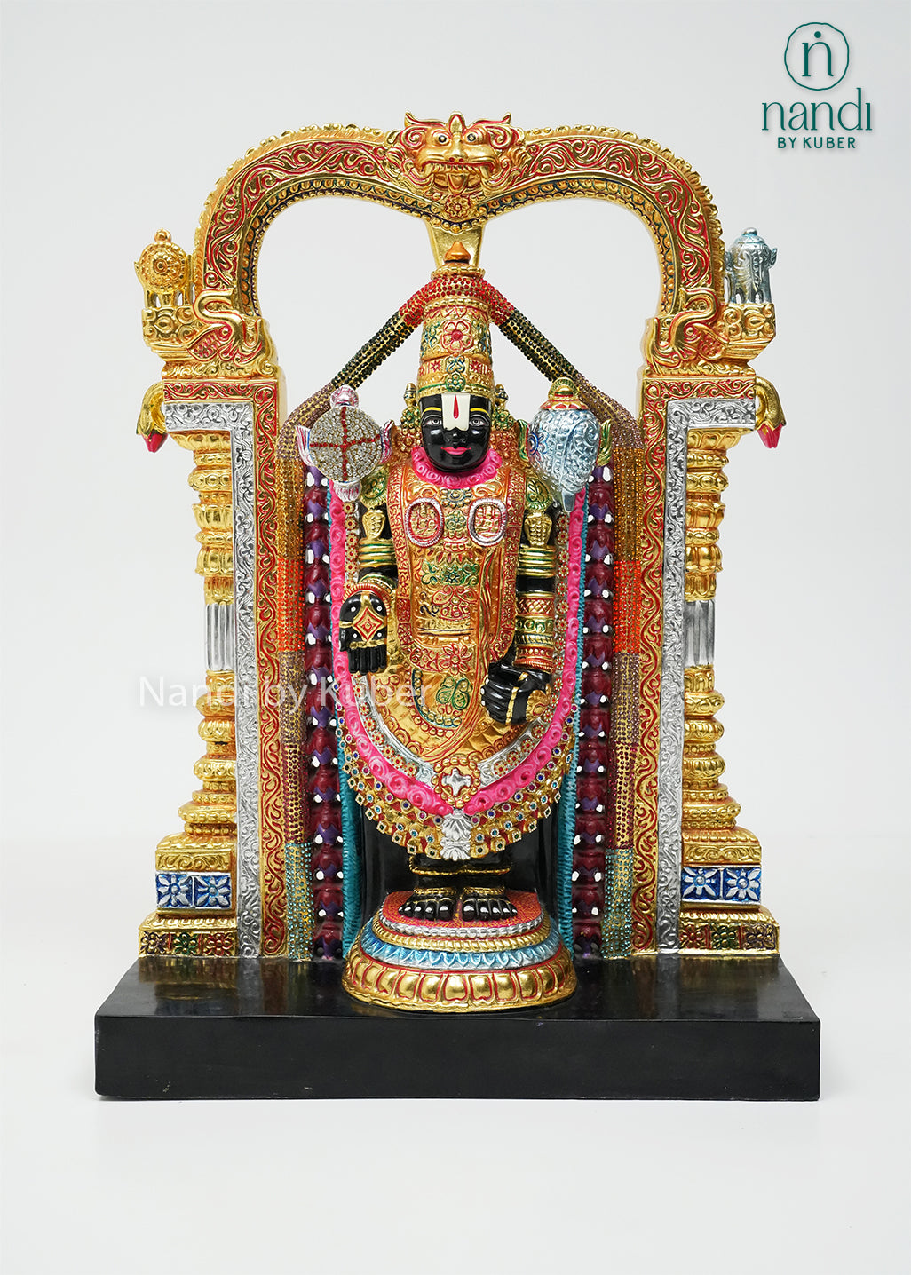 Handcrafted black marble Balaji statue with vibrant hand-painted detailing, decorative temple arch, and intricate ornamentation, ideal for pooja rooms, spiritual décor, gifting, and traditional home decoration.