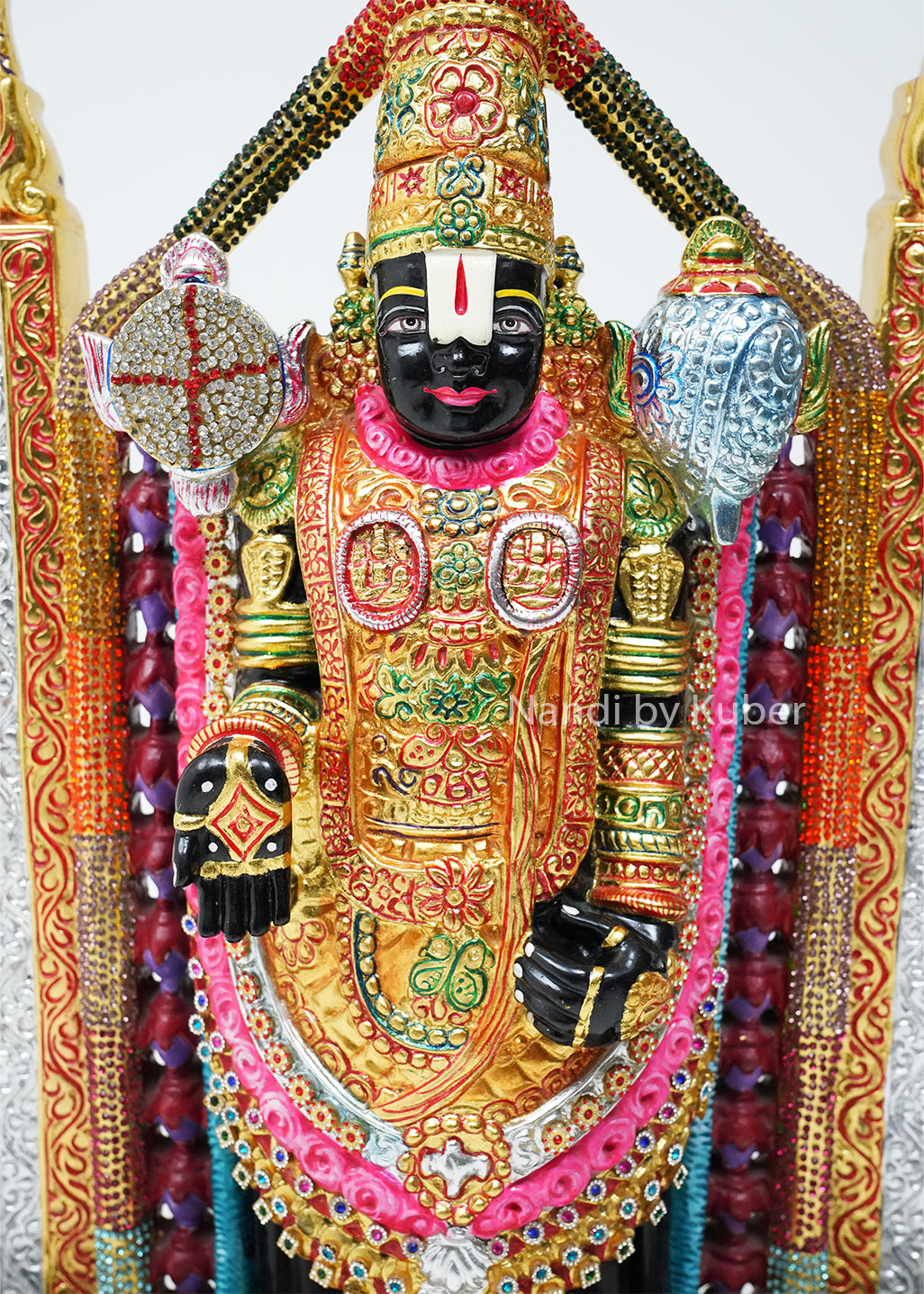Handcrafted black marble Balaji statue with vibrant hand-painted detailing, decorative temple arch, and intricate ornamentation, ideal for pooja rooms, spiritual décor, gifting, and traditional home decoration.