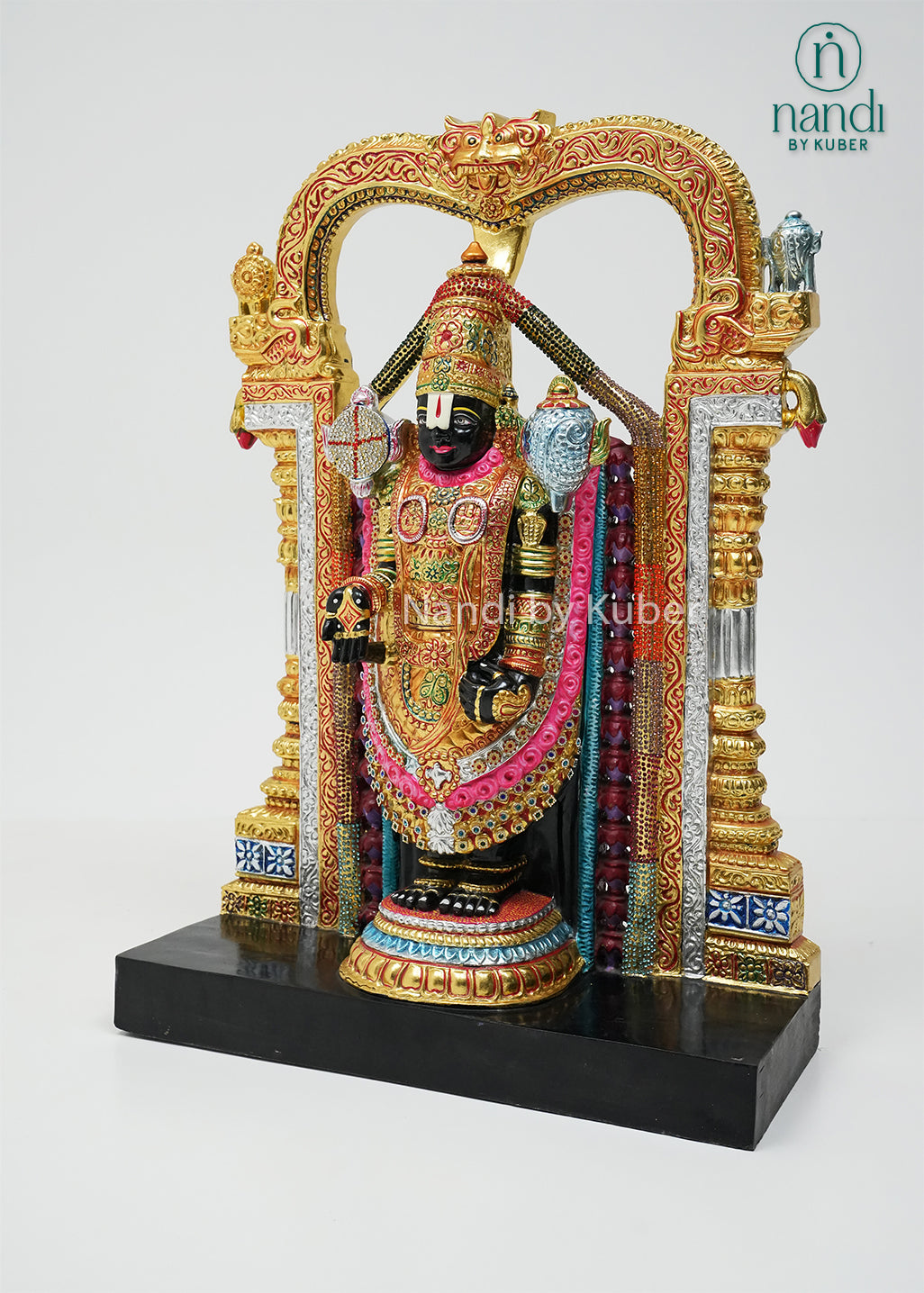 Handcrafted black marble Balaji statue with vibrant hand-painted detailing, decorative temple arch, and intricate ornamentation, ideal for pooja rooms, spiritual décor, gifting, and traditional home decoration.