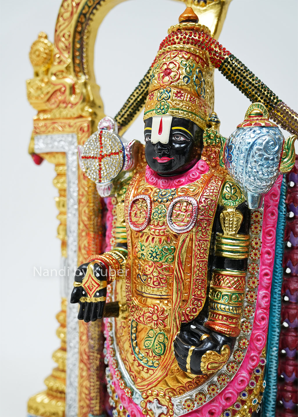 Handcrafted black marble Balaji statue with vibrant hand-painted detailing, decorative temple arch, and intricate ornamentation, ideal for pooja rooms, spiritual décor, gifting, and traditional home decoration.