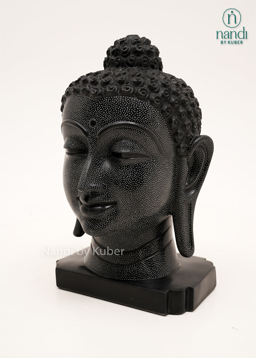 Handcrafted black marble Buddha head statue with peaceful meditative expression, intricate carved detailing, and elegant black finish, ideal for home décor, meditation spaces, spiritual interiors, and gifting.