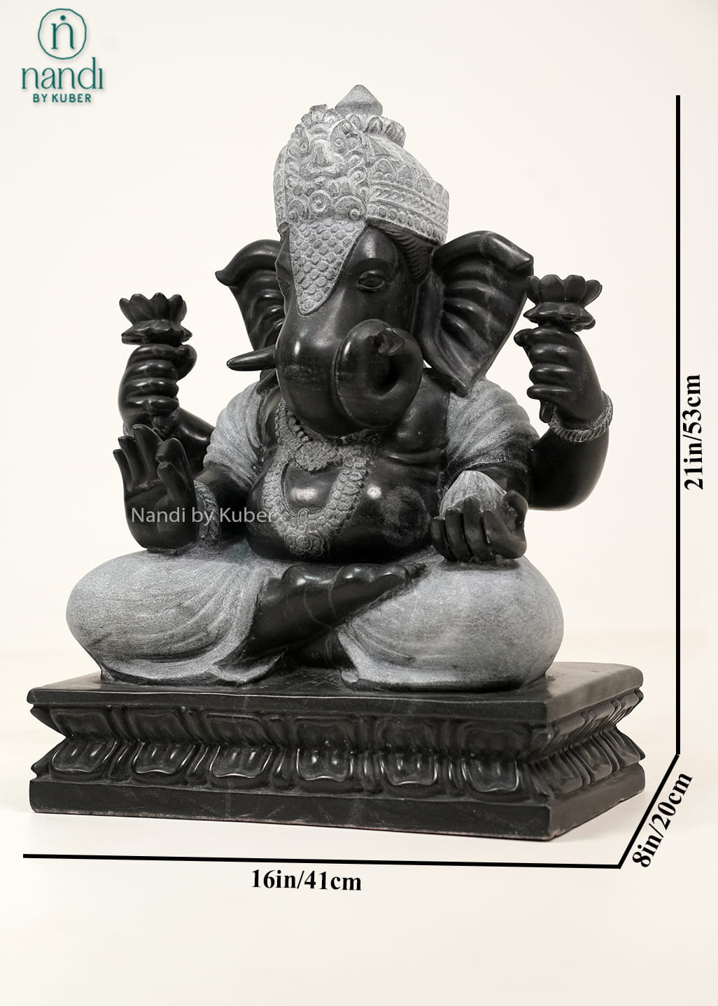 Black and white marble-style Lord Ganesha statue with intricate carvings, lotus motifs, and an elegant dual-tone finish.