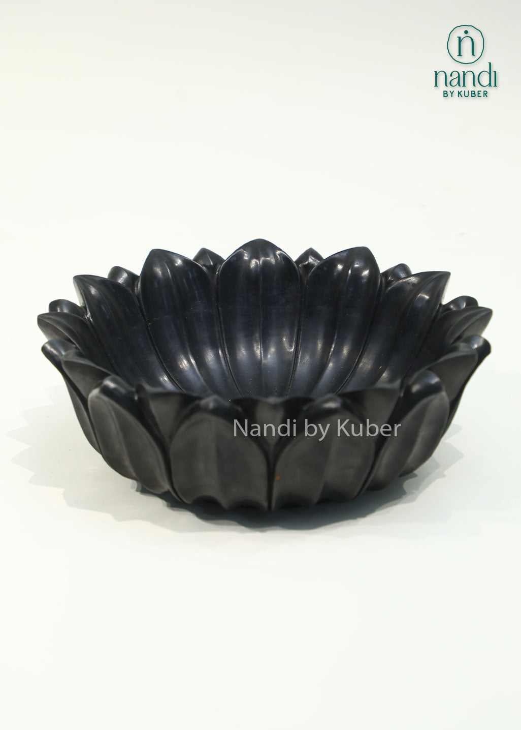 Handcrafted black marble lotus urli with elegant layered petals, perfect for floating flowers, candles, and decorative centerpieces.