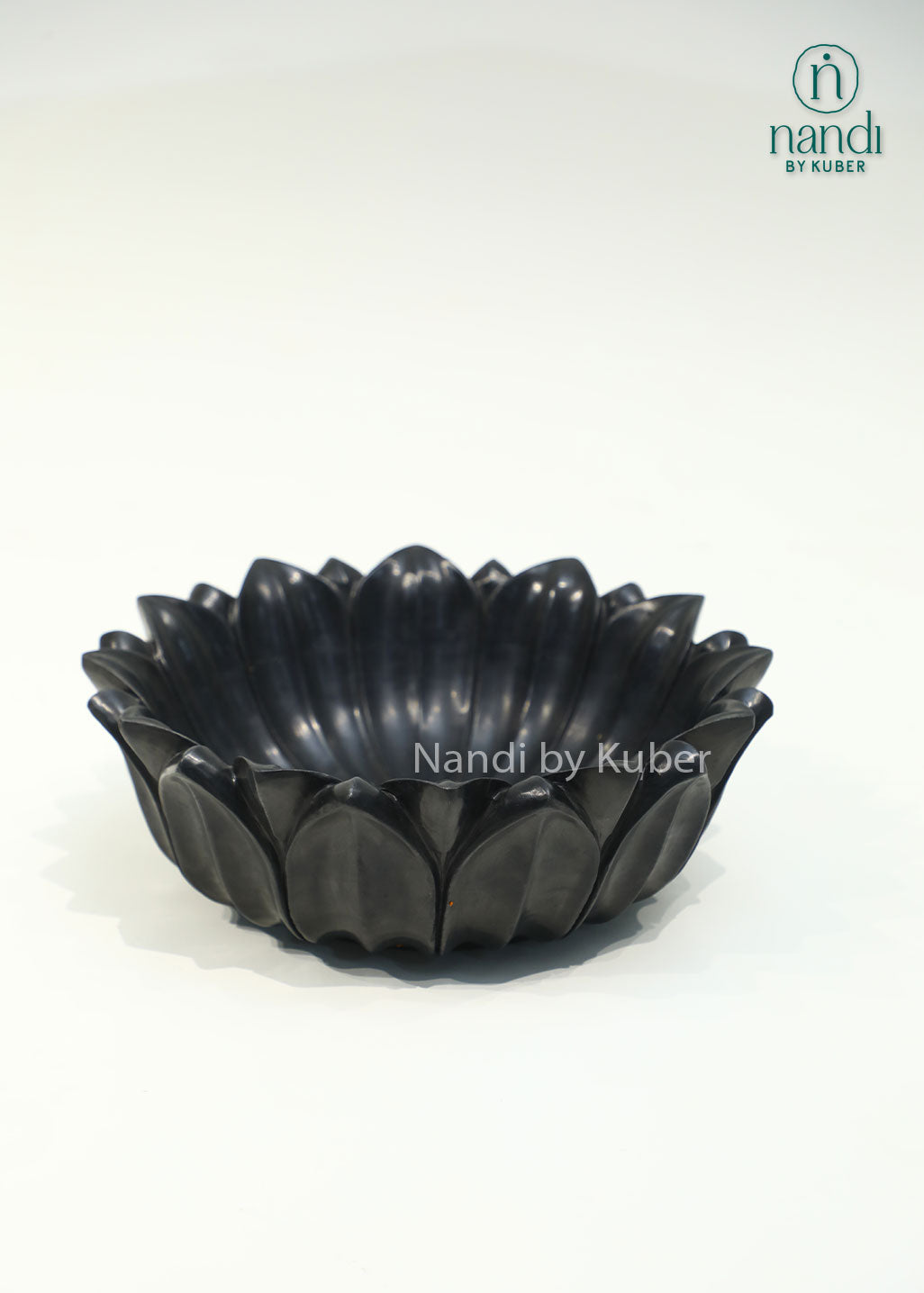 Handcrafted black marble lotus urli with elegant layered petals, perfect for floating flowers, candles, and decorative centerpieces.