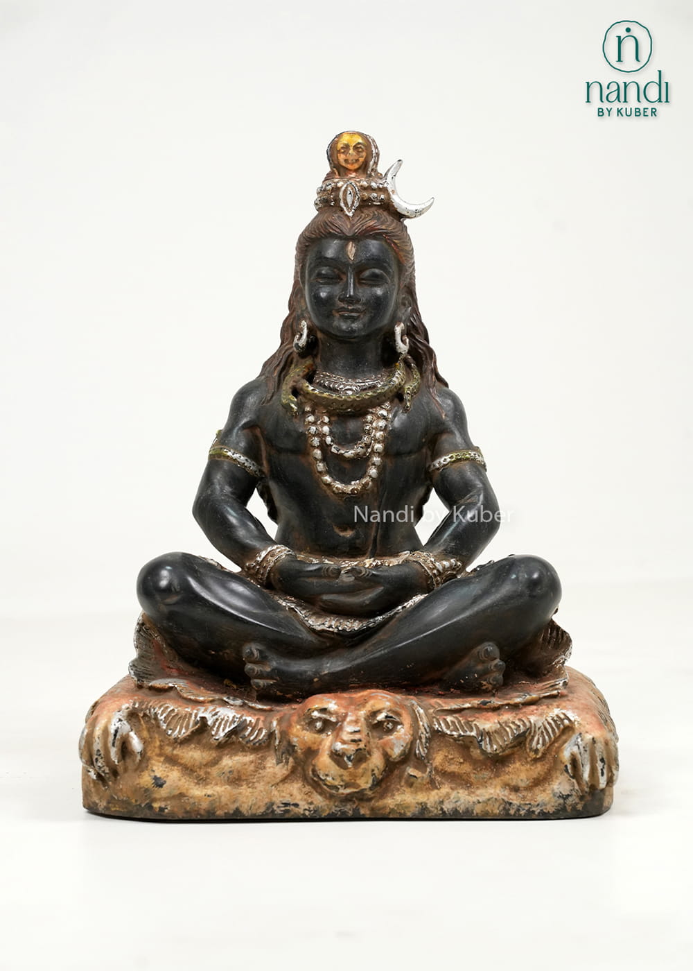 Black marble-style Lord Shiva statue in a meditative pose with detailed ornaments and an intricately crafted decorative base.