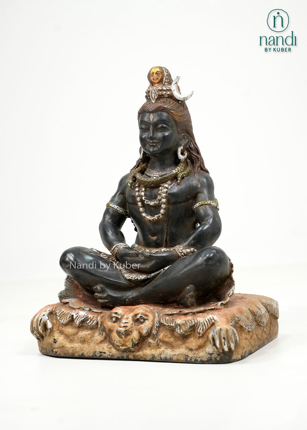 Black marble-style Lord Shiva statue in a meditative pose with detailed ornaments and an intricately crafted decorative base.