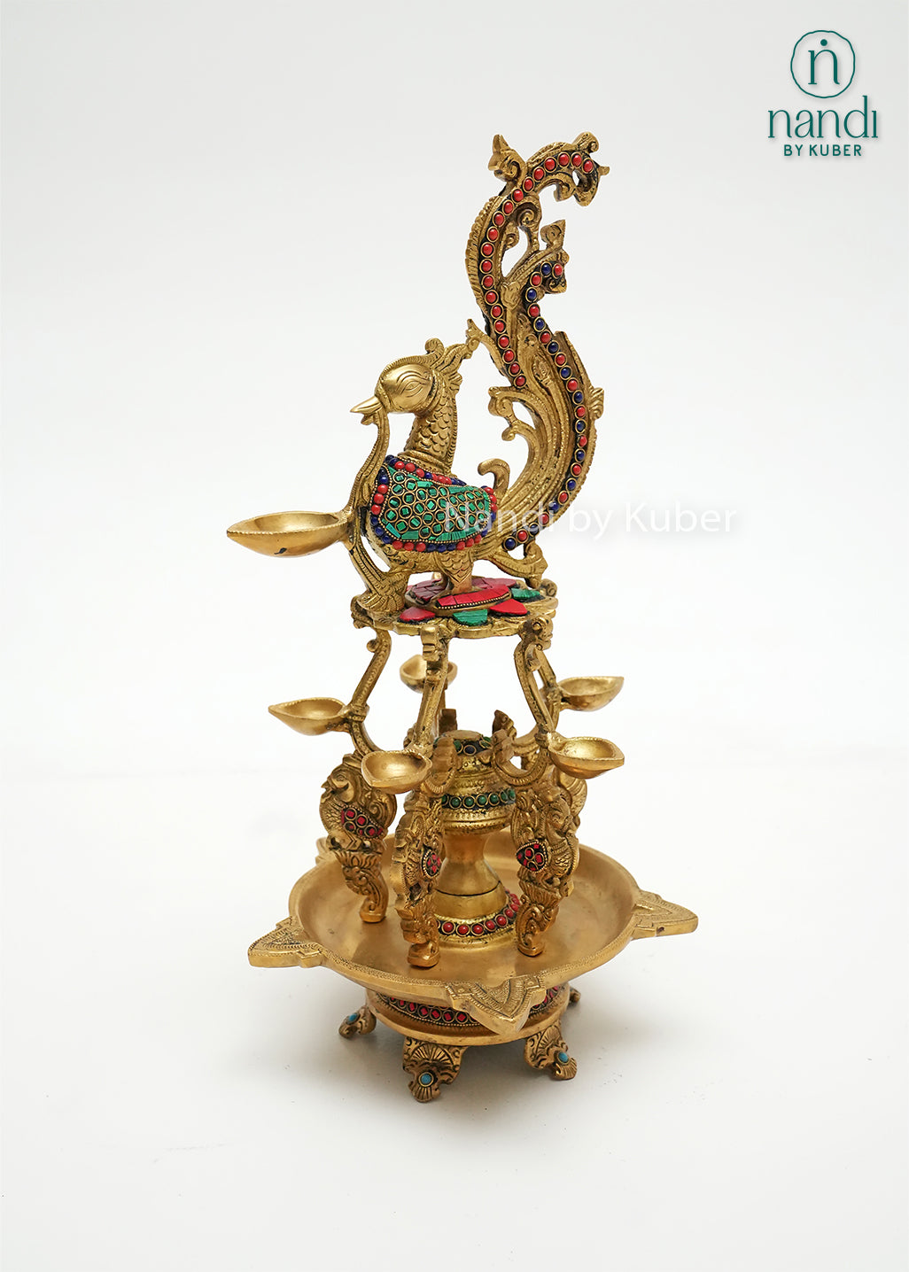 Handcrafted brass Annam diya lamp with peacock design and colorful stone work, traditional Indian oil lamp for pooja room, temple décor, festive decoration, and gifting.
