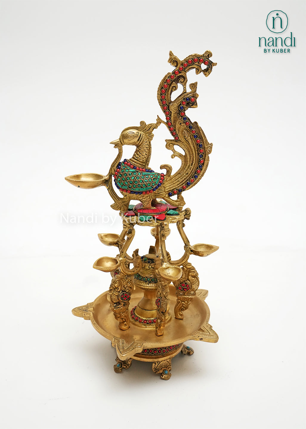 Handcrafted brass Annam diya lamp with peacock design and colorful stone work, traditional Indian oil lamp for pooja room, temple décor, festive decoration, and gifting.