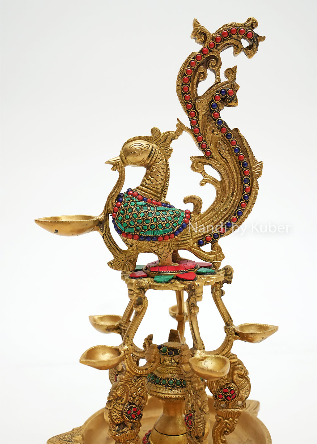 Handcrafted brass Annam diya lamp with peacock design and colorful stone work, traditional Indian oil lamp for pooja room, temple décor, festive decoration, and gifting.