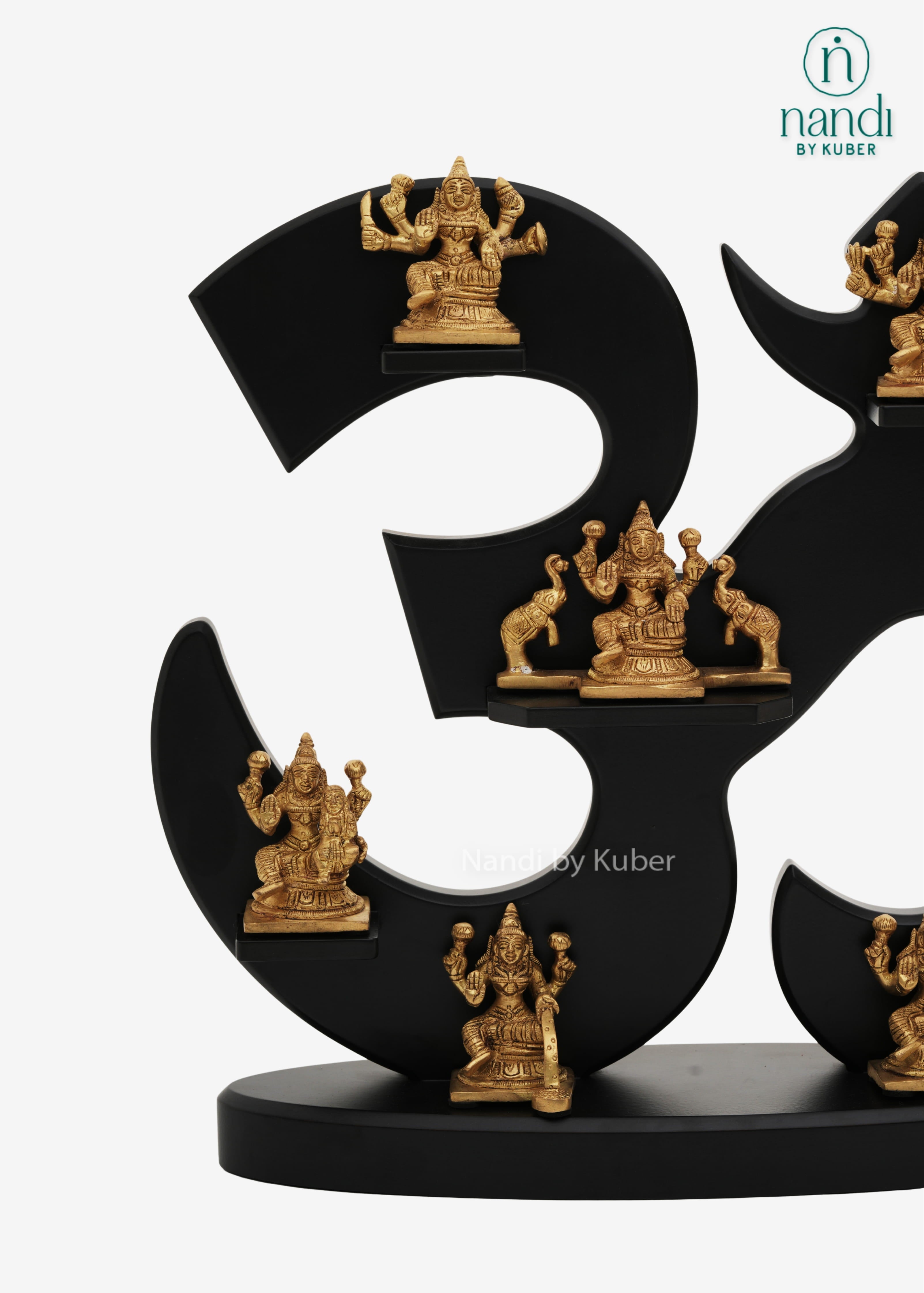 Decorative Ashtalakshmi brass figurine set on black Om symbol display stand