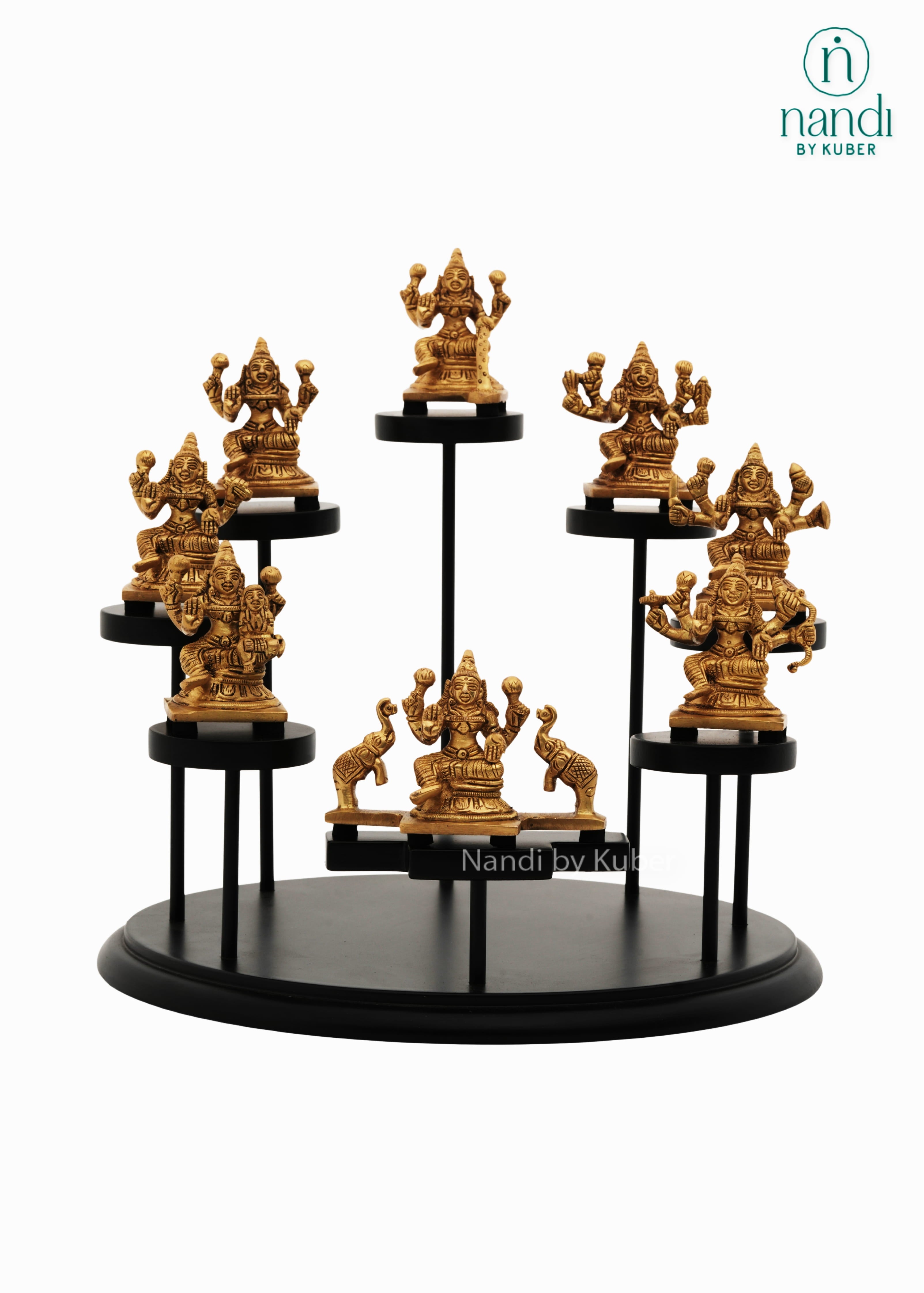Decorative brass Ashtalakshmi idol set displayed on a tiered round stand