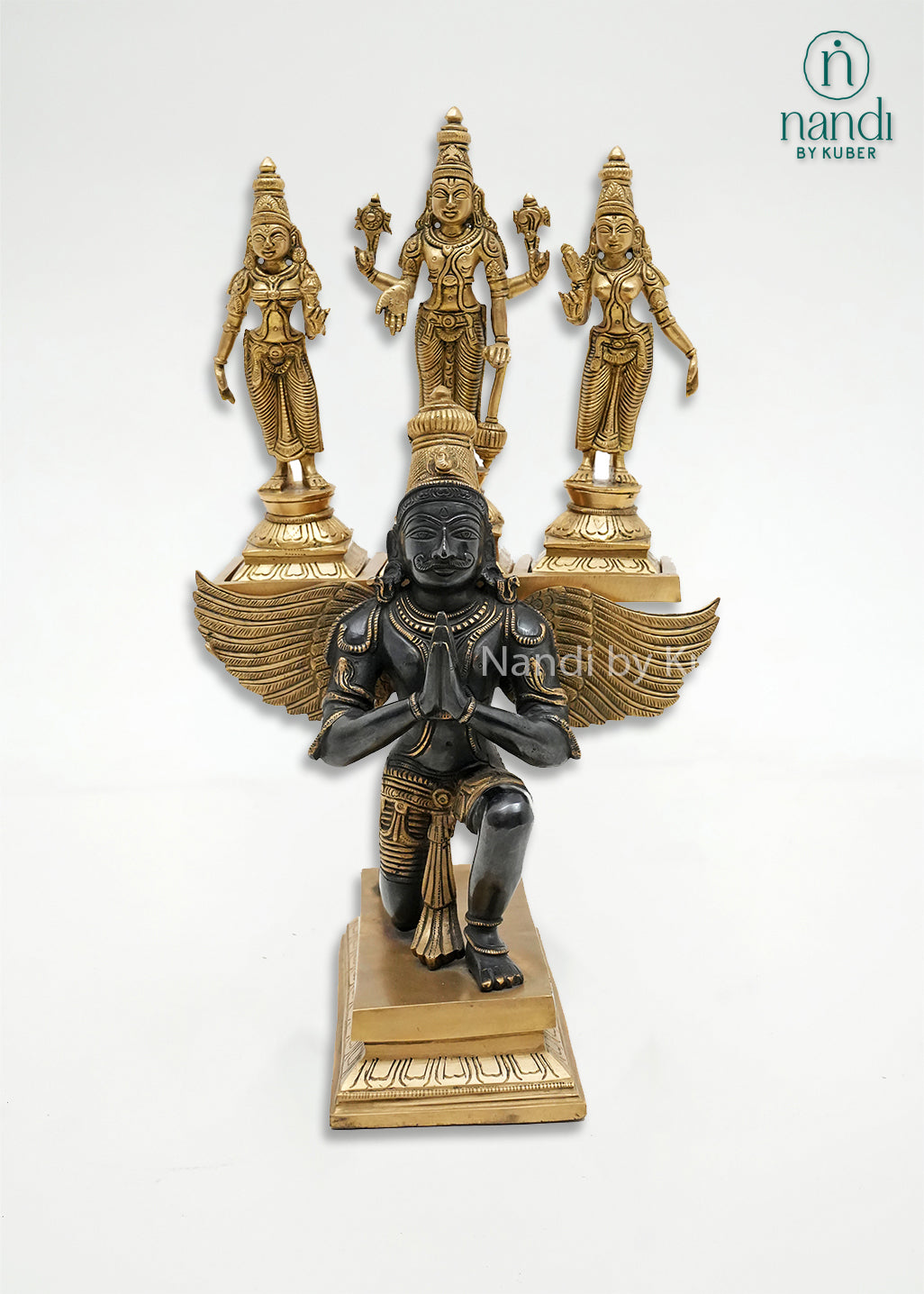 Handcrafted brass Vishnu with Sridevi and Bhudevi statue set, accompanied by a decorative Garuda figure in a black and gold finish, ideal for home temples, spiritual décor, and devotional worship.