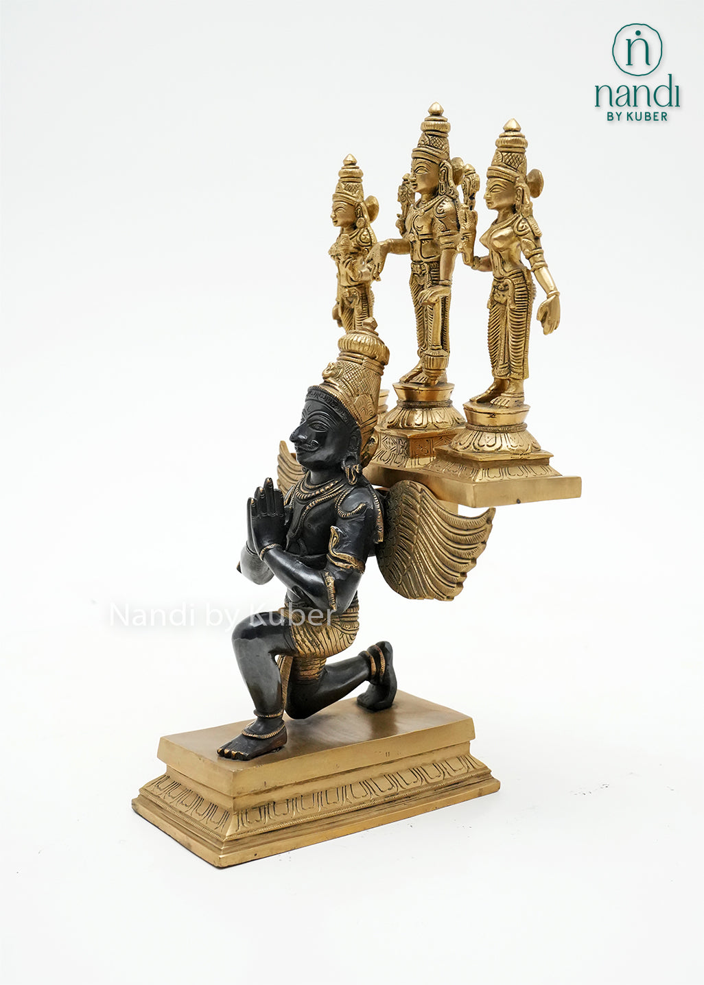 Handcrafted brass Vishnu with Sridevi and Bhudevi statue set, accompanied by a decorative Garuda figure in a black and gold finish, ideal for home temples, spiritual décor, and devotional worship.
