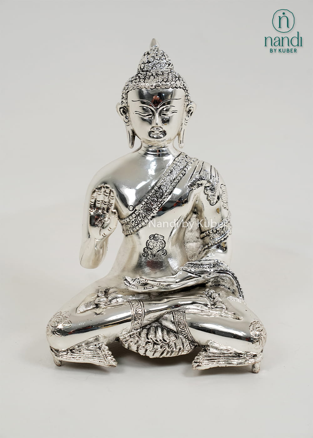 Silver Buddha statue with Ashtamangala detailing