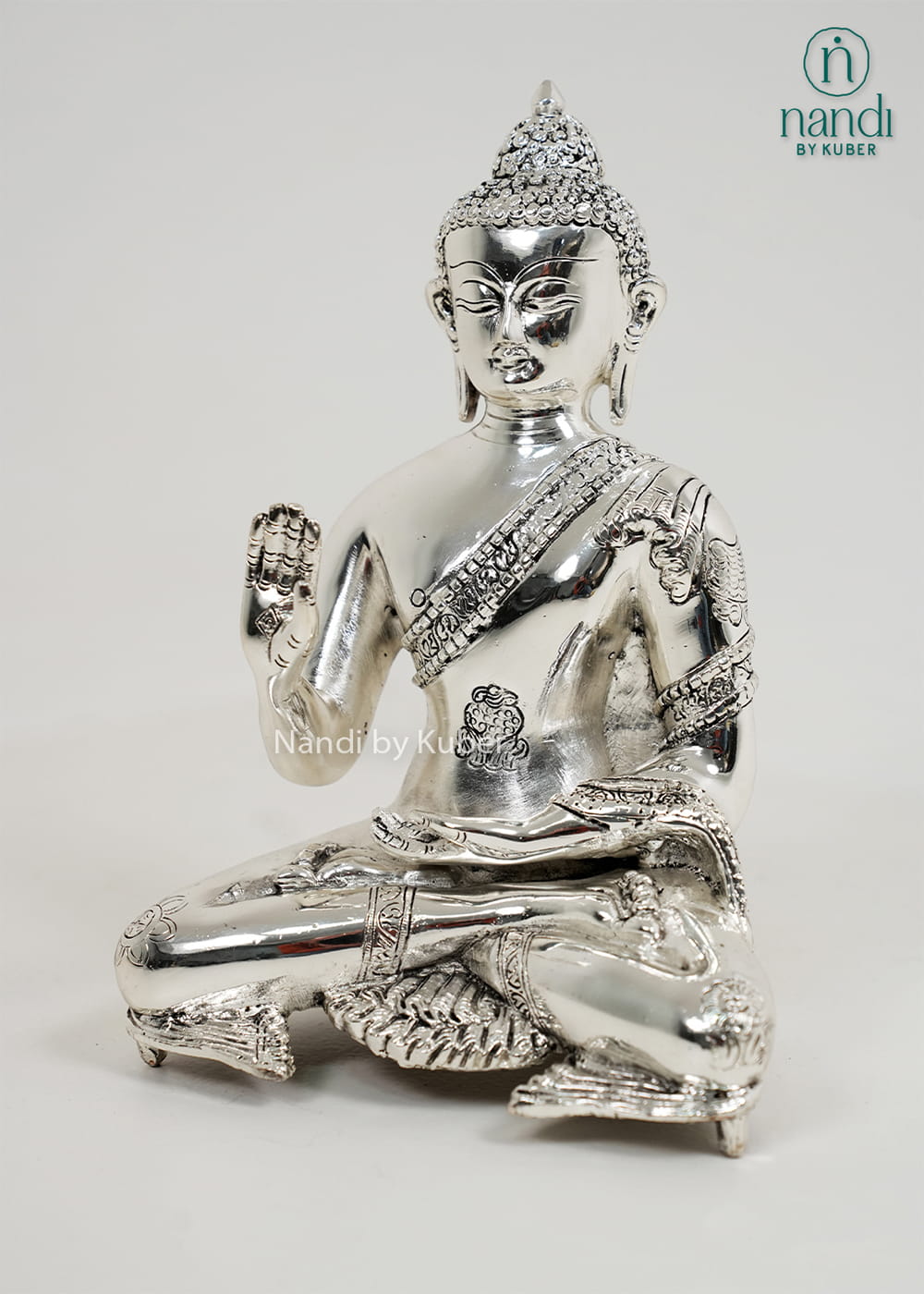 Silver Buddha statue with Ashtamangala detailing