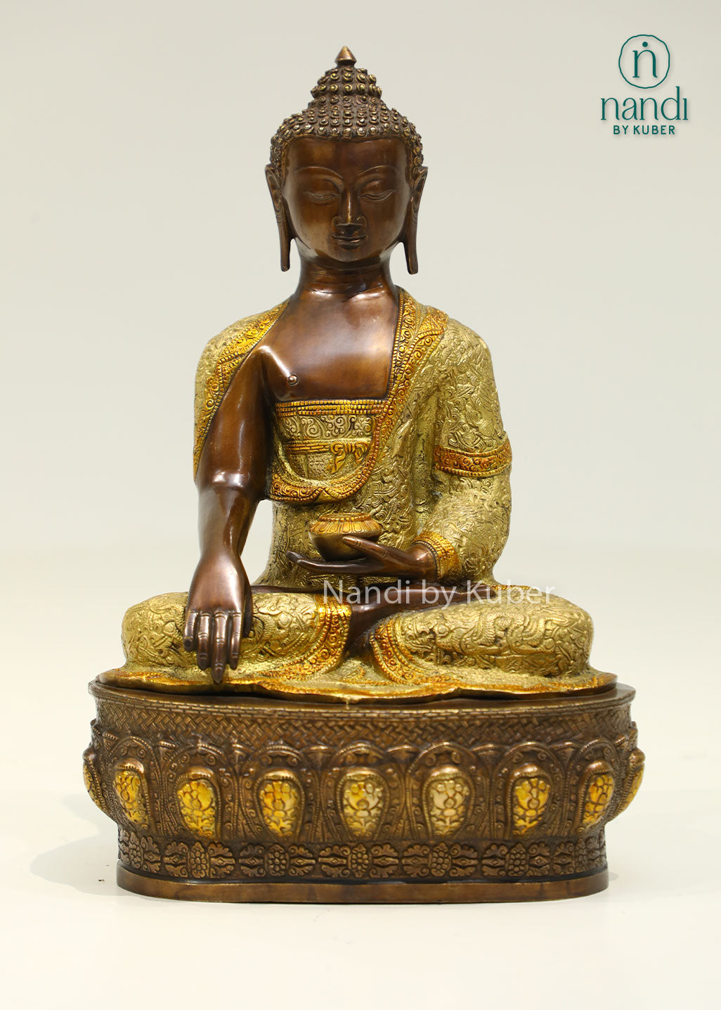 Handcrafted brass Buddha statue with antique bronze and gold finish, seated on a detailed lotus pedestal, perfect for meditation and spiritual décor.
