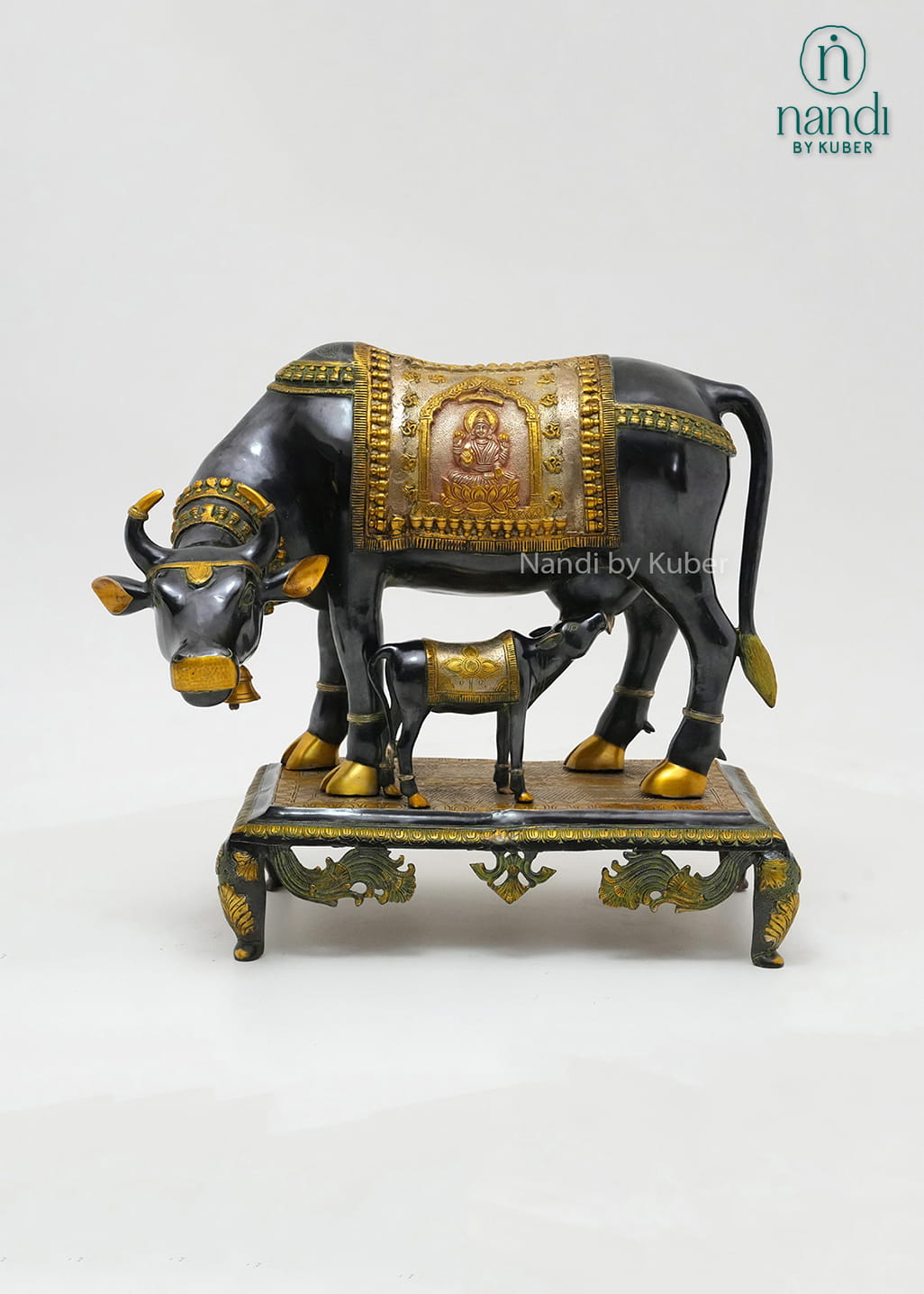 Decorative brass cow and calf figurine with a three-tone