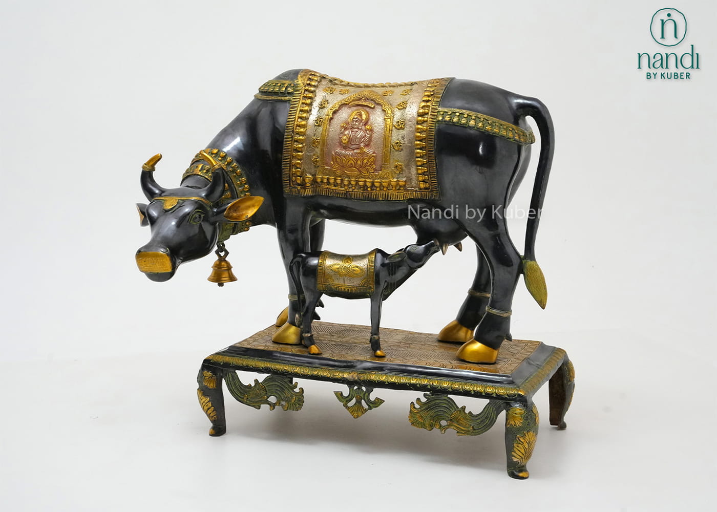 Decorative brass cow and calf figurine with a three-tone