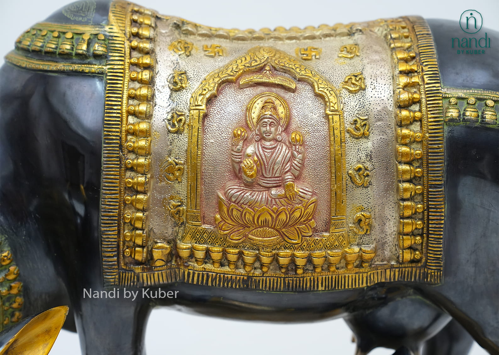 Decorative brass cow and calf figurine with a three-tone