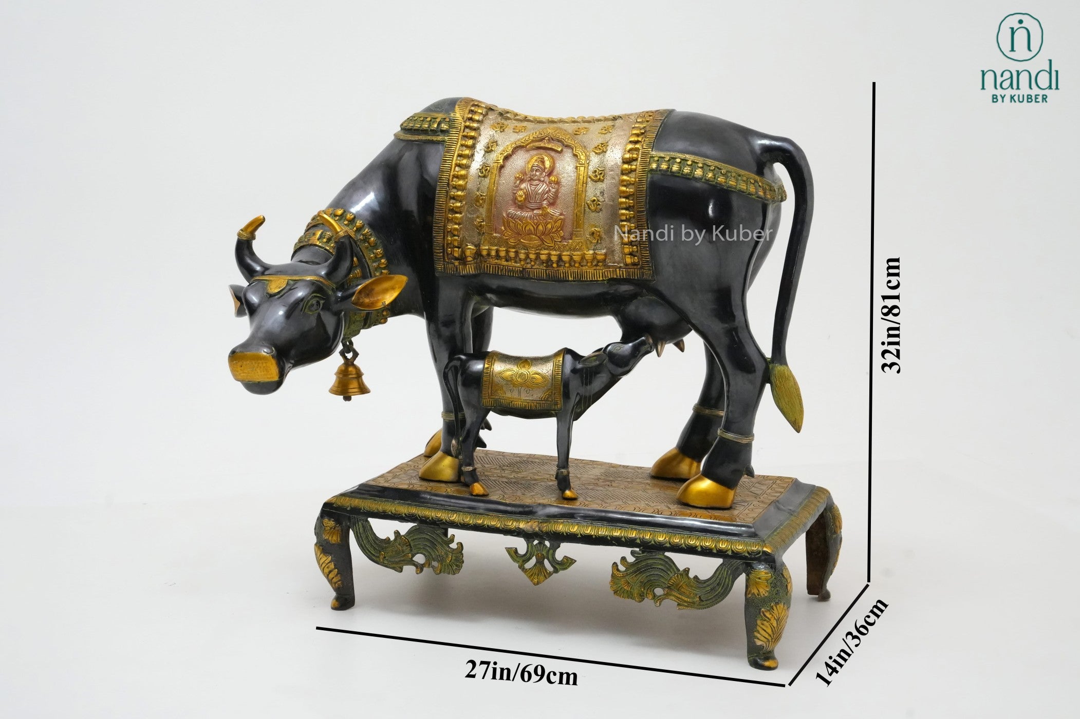 Decorative brass cow and calf figurine with a three-tone