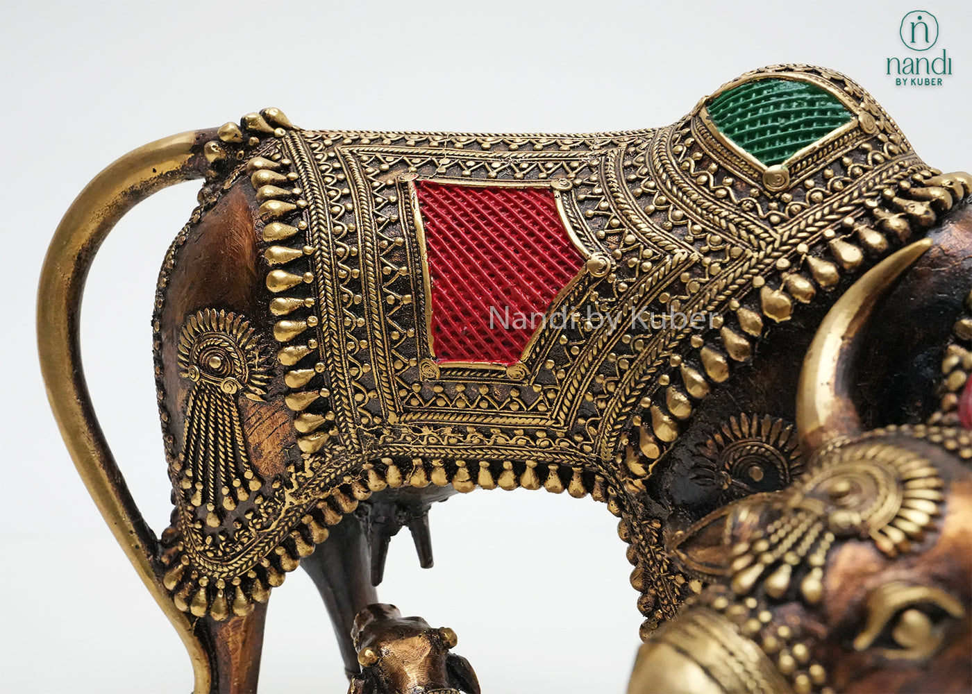 Decorative brass Cow and Calf statue with ornate detailing and colorful enamel work, symbolizing prosperity, nurturing, and divine blessings.