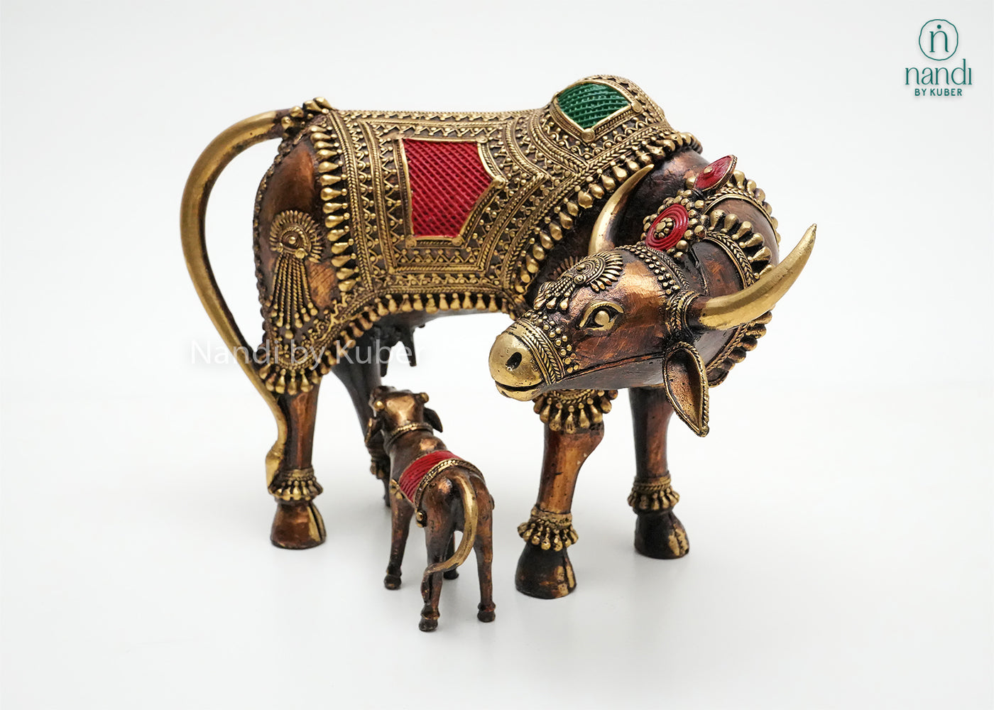 Decorative brass Cow and Calf statue with ornate detailing and colorful enamel work, symbolizing prosperity, nurturing, and divine blessings.