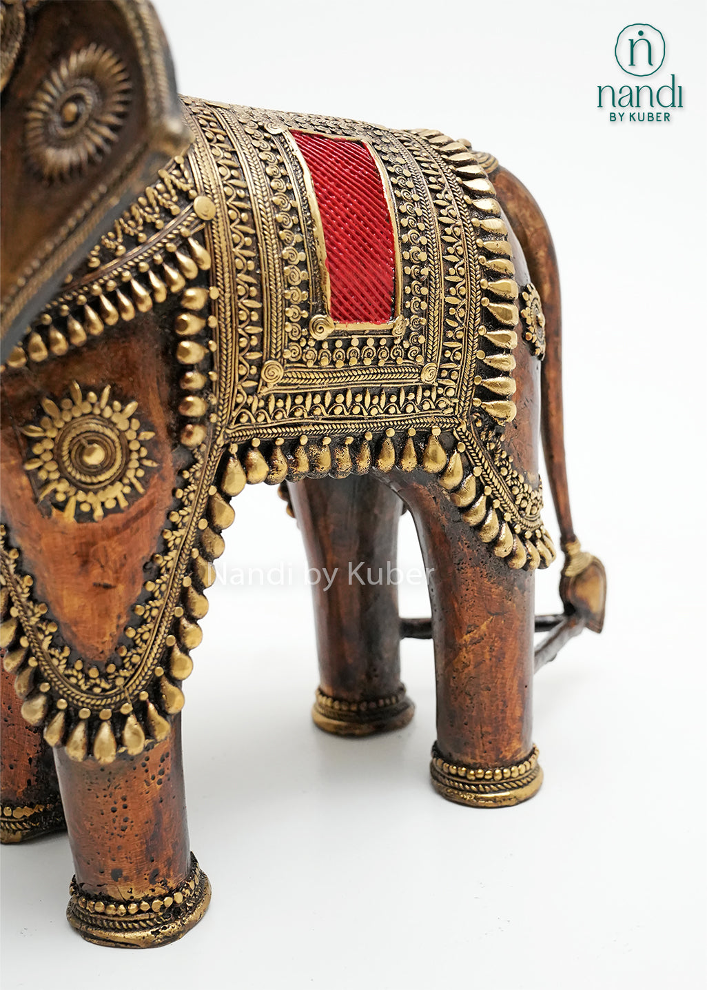 Decorative brass elephant statue with ornate detailing and enamel accents, symbolizing wisdom, strength, prosperity, and good fortune.