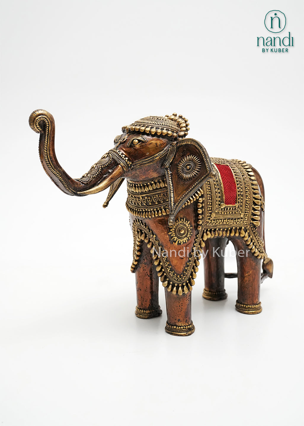 Decorative brass elephant statue with ornate detailing and enamel accents, symbolizing wisdom, strength, prosperity, and good fortune.