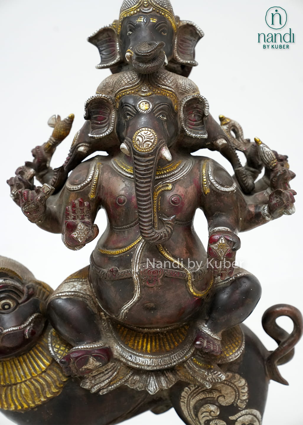 Antique-finish brass Panchamukhi Ganesha statue with five faces, seated on a lion mount and crafted with intricate traditional detailing.